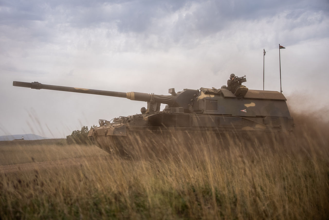 A Hungarian PZH2000 mobile artillery unit moves through grassland. Exercise Adaptive Hussars 2025 was the Hungarian Defence Forces’ largest and most complex military exercise since Hungary’s accession to NATO in 1999. It promoted cooperation between all NATO members contributing to the NATO’s multinational battlegroup in Hungary, and boosted Hungary’s  defence capabilities along with NATO defence plans and procedures.