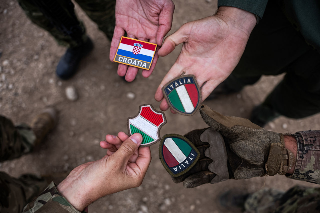 Croatian, Hungarian and Italian soldiers show off their patches. Exercise Adaptive Hussars 2025 was the Hungarian Defence Forces’ largest and most complex military exercise since Hungary’s accession to NATO in 1999. It promoted cooperation between all NATO members contributing to the NATO’s multinational battlegroup in Hungary, and boosted Hungary’s  defence capabilities along with NATO defence plans and procedures.