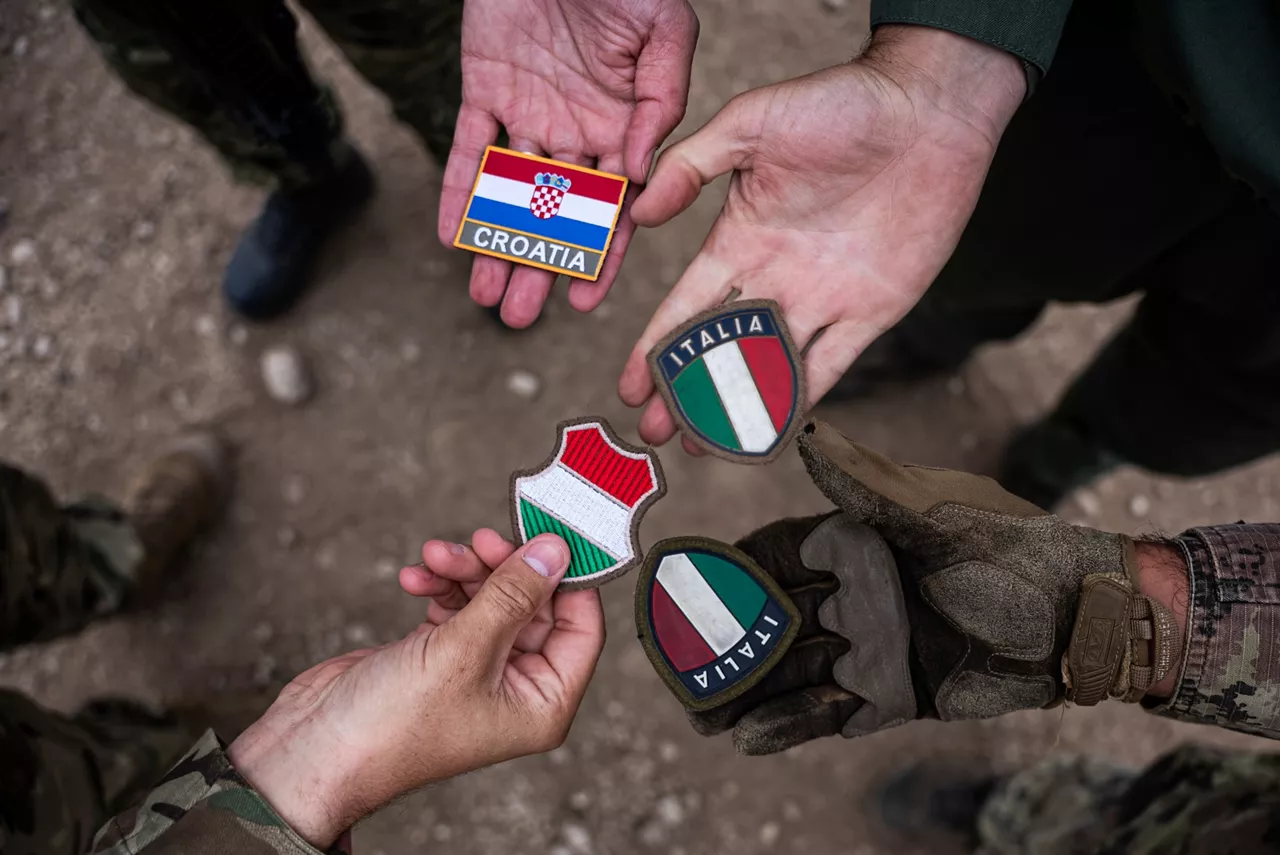 Croatian, Hungarian and Italian soldiers show off their patches. Exercise Adaptive Hussars 2025 was the Hungarian Defence Forces’ largest and most complex military exercise since Hungary’s accession to NATO in 1999. It promoted cooperation between all NATO members contributing to the NATO’s multinational battlegroup in Hungary, and boosted Hungary’s  defence capabilities along with NATO defence plans and procedures.