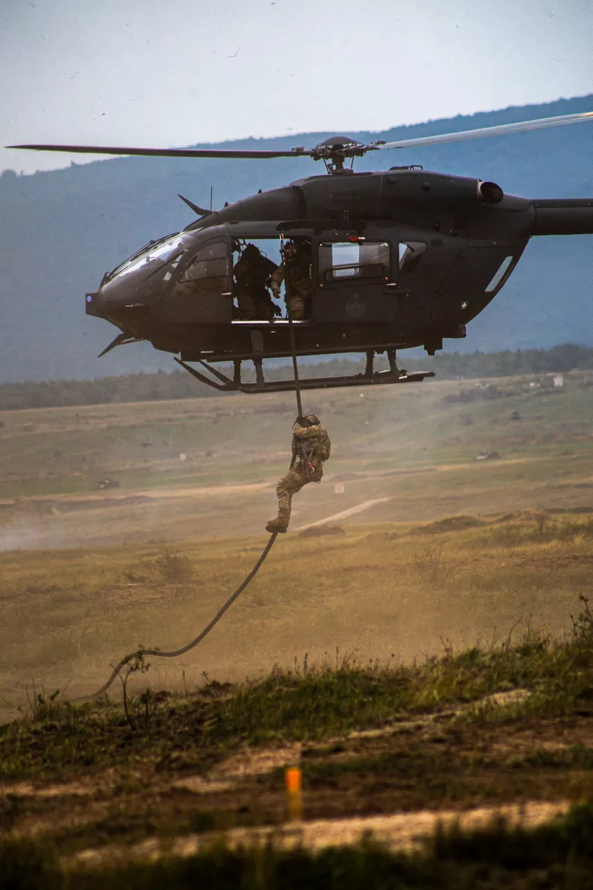 A Hungarian Air Force helicopter drops a member of the special forces by rope. Exercise Adaptive Hussars 2025 was the Hungarian Defence Forces’ largest and most complex military exercise since Hungary’s accession to NATO in 1999. It promoted cooperation between all NATO members contributing to the NATO’s multinational battlegroup in Hungary, and boosted Hungary’s  defence capabilities along with NATO defence plans and procedures.
