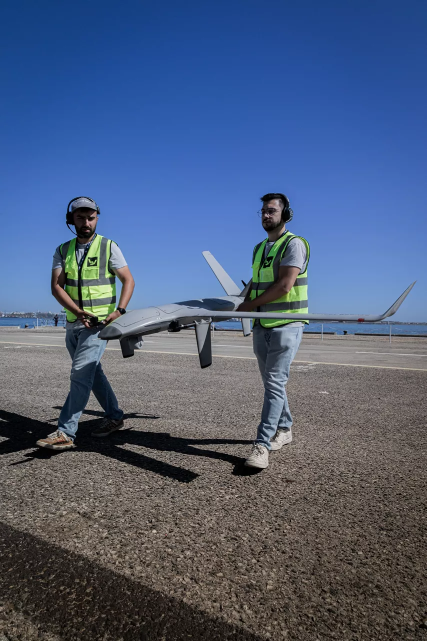 Two crew members carry unmanned aerial vehicle during REPMUS 2025.

During Exercises REPMUS and Dynamic Messenger 2025, NATO united Allied forces, partners, industry, and researchers to trial uncrewed systems, advanced sensing, and communications in real-life tests scenarios at sea. NATO’s Defence Innovation Accelerator (DIANA) helps turn new ideas into real capabilities by connecting innovators with real-world trials, making it easier for Allies to adopt technology, work together, and use innovative technologies to strengthen defence.