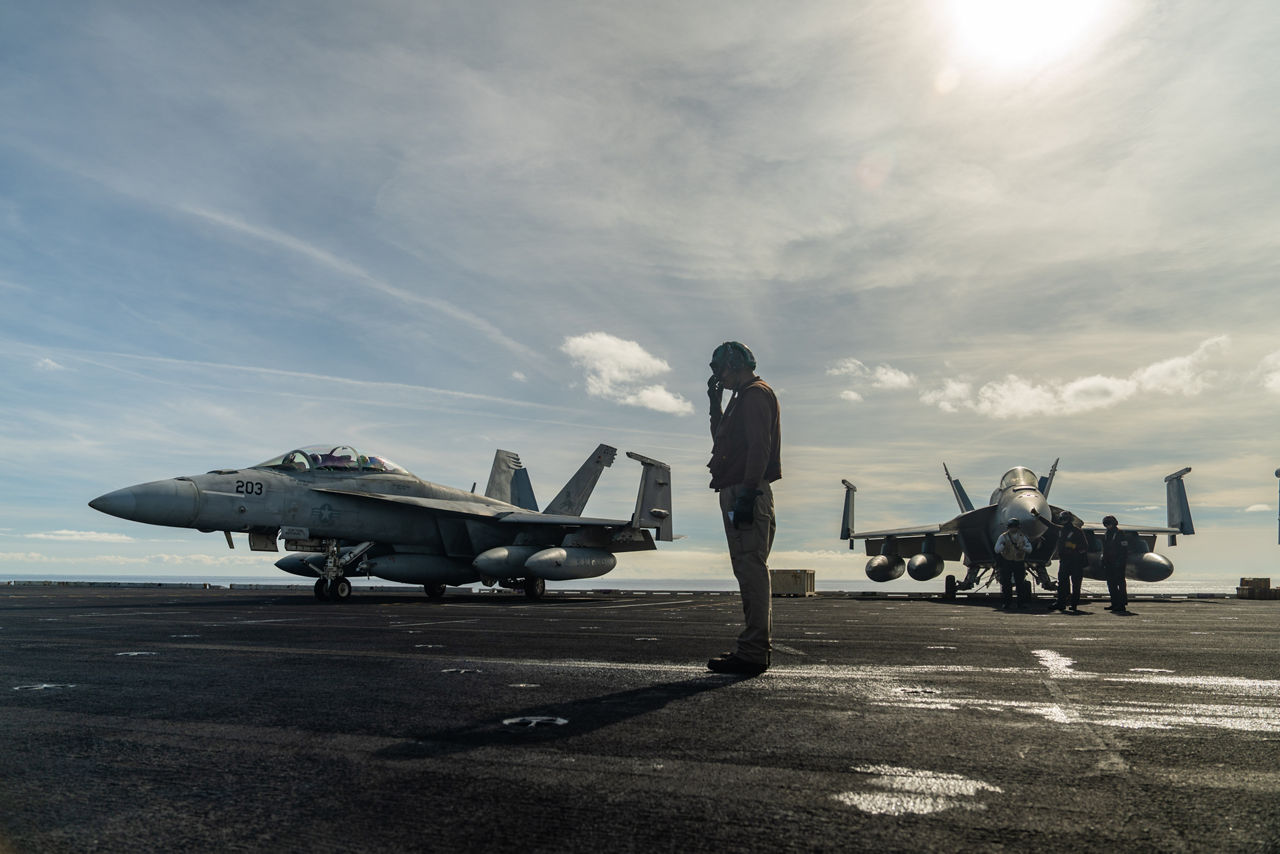 A US Navy F/A-18 Super Hornet taxis on the flight deck of the USS Gerald R. Ford.

The USS Gerald R. Ford sailed under NATO command for Neptune Strike 25-3, a long-planned enhanced vigilance activity designed to demonstrate the complex integration of high-end maritime strike capabilities and air-land integration. It took place from 22 until 26 September 2025.