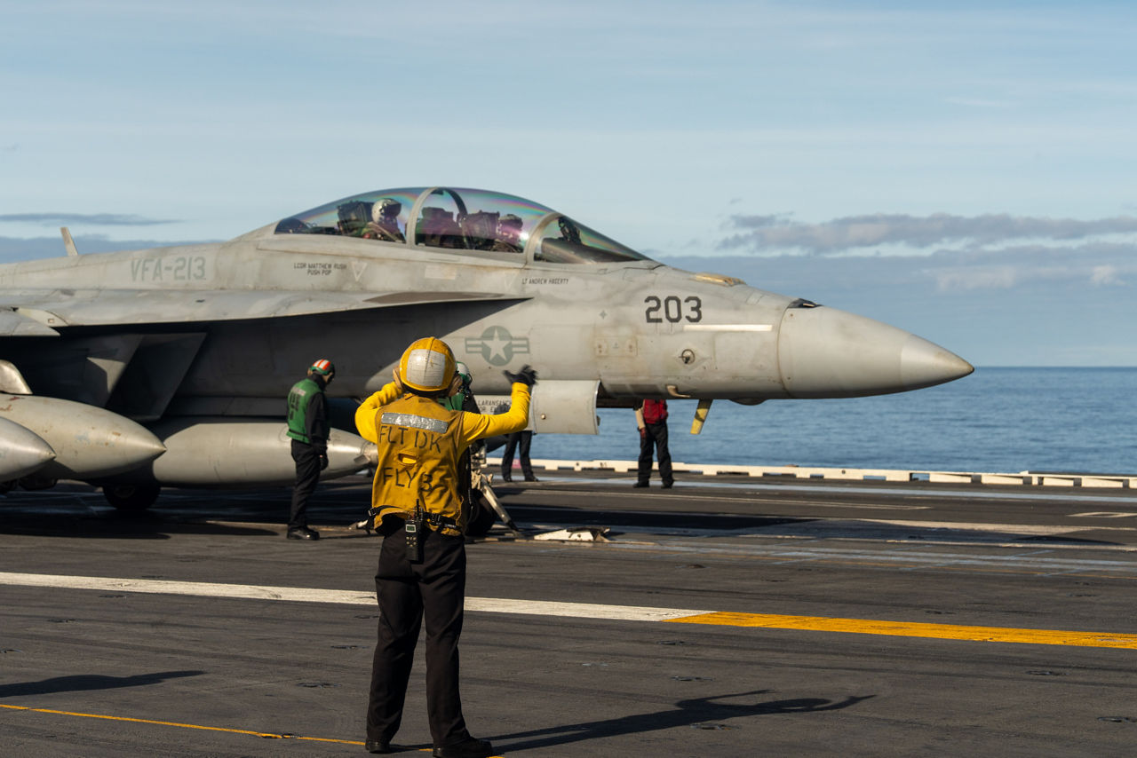 A US Navy F/A-18 Super Hornet prepares to be launched off the flight deck of the USS Gerald R. Ford as the shooter makes its final check.

The USS Gerald R. Ford sailed under NATO command for Neptune Strike 25-3, a long-planned enhanced vigilance activity designed to demonstrate the complex integration of high-end maritime strike capabilities and air-land integration. It took place from 22 until 26 September 2025.