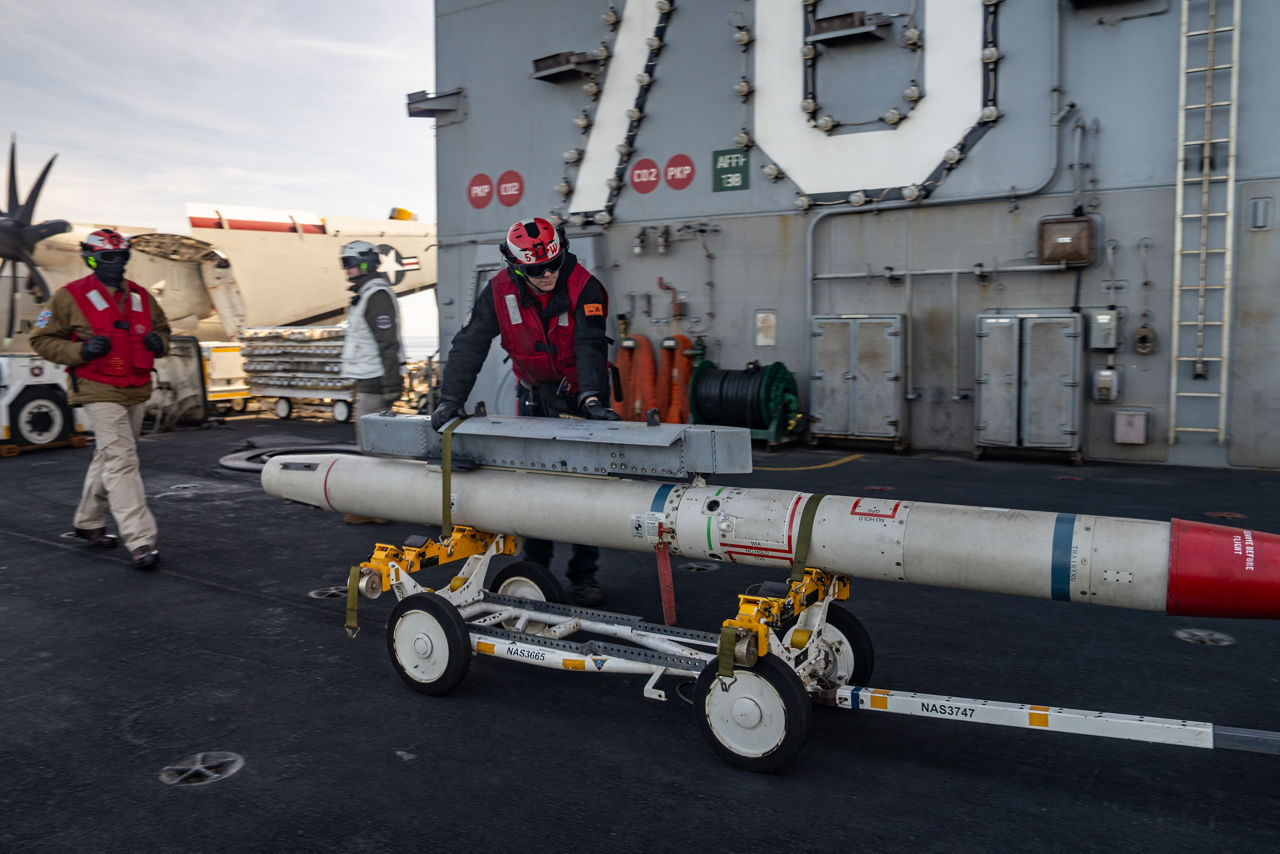 US Navy sailors transfer ordnance on the flight deck of the USS Gerald R. Ford.

The USS Gerald R. Ford sailed under NATO command for Neptune Strike 25-3, a long-planned enhanced vigilance activity designed to demonstrate the complex integration of high-end maritime strike capabilities and air-land integration. It took place from 22 until 26 September 2025.