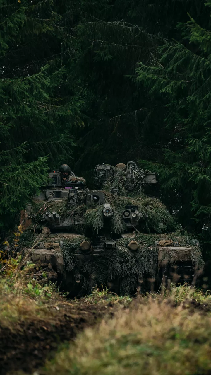 A British soldier studies a map on top of their Challenger 2 tank during Exercise Bold Eagle in Estonia. 

NATO Allies tested their quick reaction defence skills in Estonia during Exercise Bold Panzer, strengthening NATO’s ability to respond to any incursion into Estonian territory. The exercise brought together forces from Canada, Estonia, France, Latvia, Poland, Slovenia and the UK over two weeks, ensuring their readiness to protect Estonia and the Alliance.