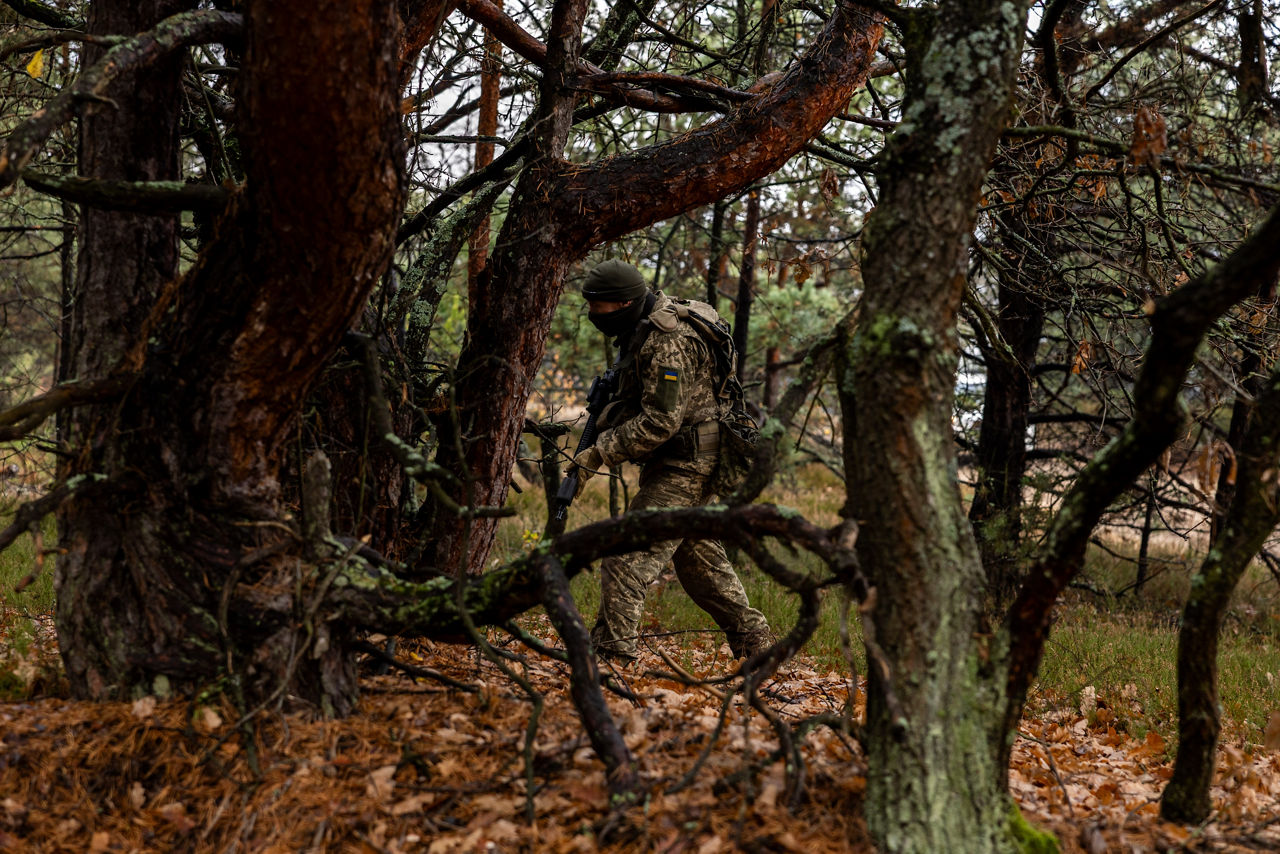A Ukrainian sapper patrols through the forest in search of simulated land mines during a combat engineer training course held at Camp Jomsborg in Poland. 

Camp Jomsborg was set up earlier this year as part of Operation Legio, an effort to train, equip and fund Ukraine’s armed forces, and is supported by Denmark, Estonia, Finland, Latvia, Lithuania, Norway, Sweden and Poland. Norway leads Legio, and its trainers work side-by-side with counterparts from the Estonian Army to equip Ukraine’s soldiers with the skills they need to fight and prevail on the battlefield.