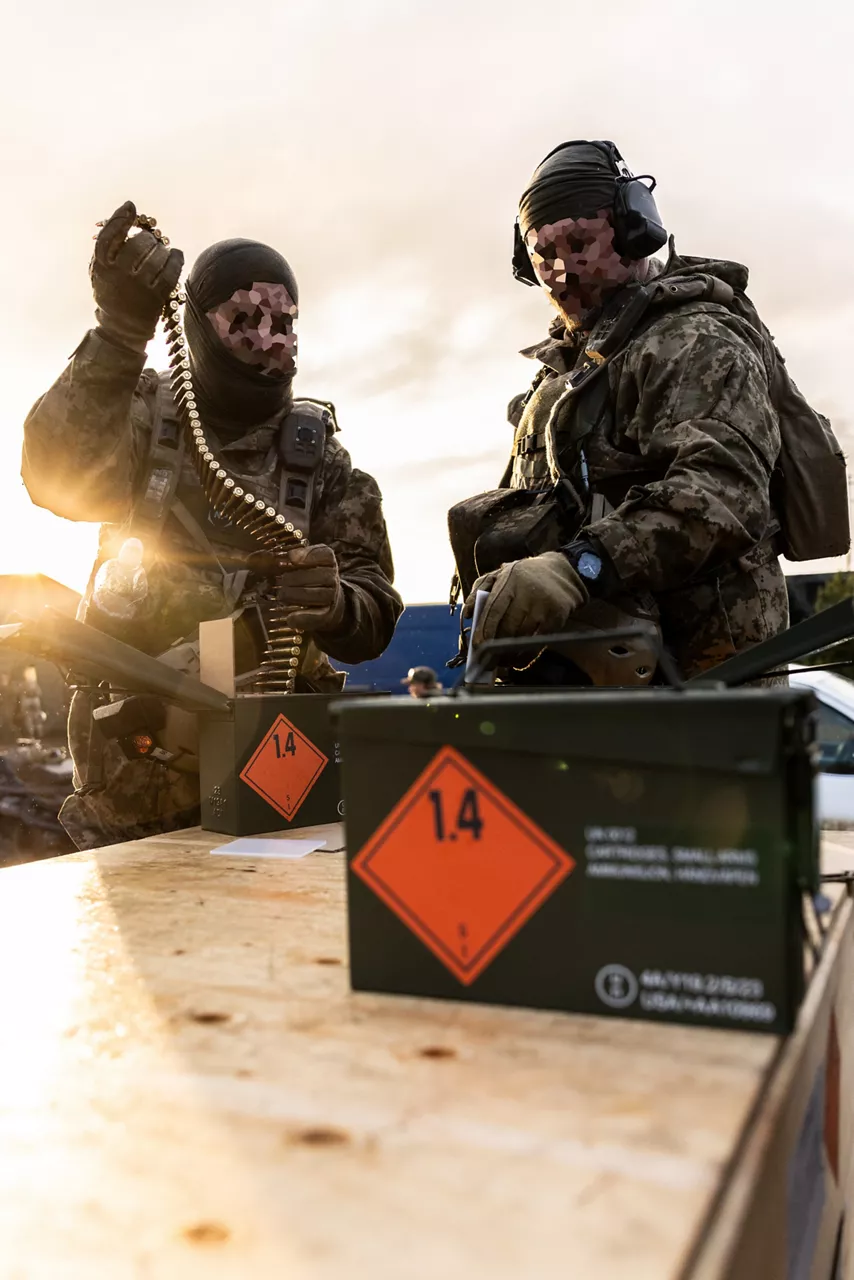 Ukrainian soldiers retrieve belts of linked ammunition from metal cans during a machine gun training held at Camp Jomsborg in Poland. 

Camp Jomsborg was set up earlier this year as part of Operation Legio, an effort to train, equip and fund Ukraine’s armed forces, and is supported by Denmark, Estonia, Finland, Latvia, Lithuania, Norway, Sweden and Poland. Norway leads Legio, and its trainers work side-by-side with counterparts from the Estonian Army to equip Ukraine’s soldiers with the skills they need to fight and prevail on the battlefield.