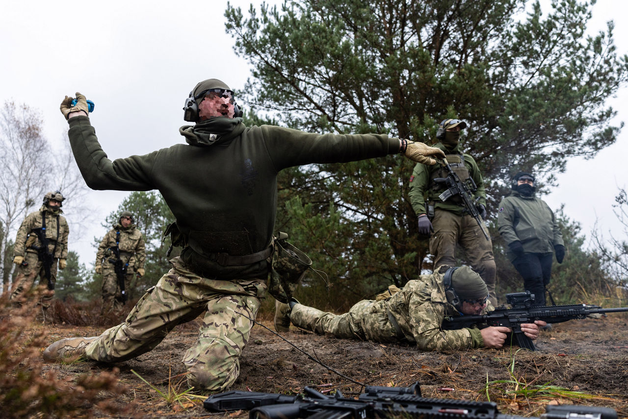 A Ukrainian Army soldier hurls a grenade at a simulated enemy foxhole during a trench-clearing class held at Camp Jomsborg in Poland. 

Camp Jomsborg was set up earlier this year as part of Operation Legio, an effort to train, equip and fund Ukraine’s armed forces, and is supported by Denmark, Estonia, Finland, Latvia, Lithuania, Norway, Sweden and Poland. Norway leads Legio, and its trainers work side-by-side with counterparts from the Estonian Army to equip Ukraine’s soldiers with the skills they need to fight and prevail on the battlefield.
