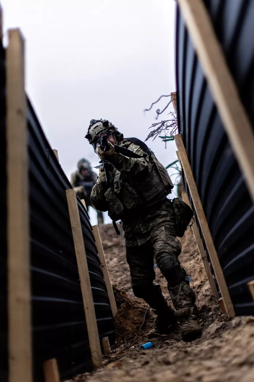 Ukrainian soldiers advance into a trench during an infantry tactics course held at Camp Jomsborg in Poland. 

Camp Jomsborg was set up earlier this year as part of Operation Legio, an effort to train, equip and fund Ukraine’s armed forces, and is supported by Denmark, Estonia, Finland, Latvia, Lithuania, Norway, Sweden and Poland. Norway leads Legio, and its trainers work side-by-side with counterparts from the Estonian Army to equip Ukraine’s soldiers with the skills they need to fight and prevail on the battlefield.