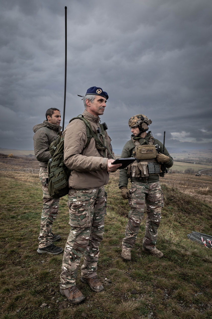 A French soldier stands holding a tablet, alongside a JTAC operator  during Dacian Fall 25. 

NATO forces in Romania demonstrated their ability to expand from a multinational battlegroup to an armoured brigade, quickly absorbing thousands of French Army troops as part of exercise Dacian Fall 25. The drills included troops from Belgium, Bulgaria, France, Germany, Italy, Luxembourg, North Macedonia, Poland, Portugal, Romania, Spain and the United States. It ran from 20 October to 13 November 2025.
