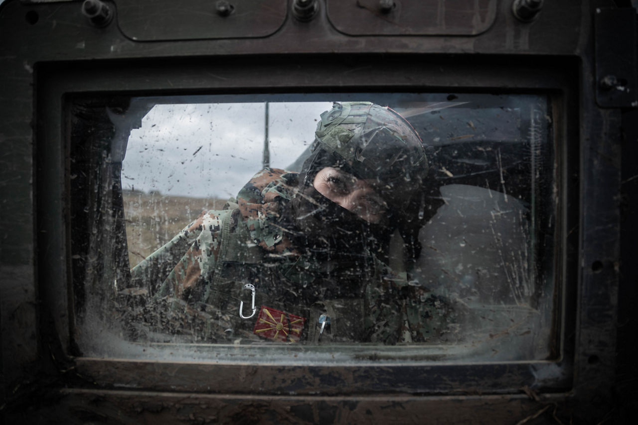 A female soldier from North Macedonia peers through Humvee window during Dacian Fall 25. 

NATO forces in Romania demonstrated their ability to expand from a multinational battlegroup to an armoured brigade, quickly absorbing thousands of French Army troops as part of exercise Dacian Fall 25. The drills included troops from Belgium, Bulgaria, France, Germany, Italy, Luxembourg, North Macedonia, Poland, Portugal, Romania, Spain and the United States. It ran from 20 October to 13 November 2025.