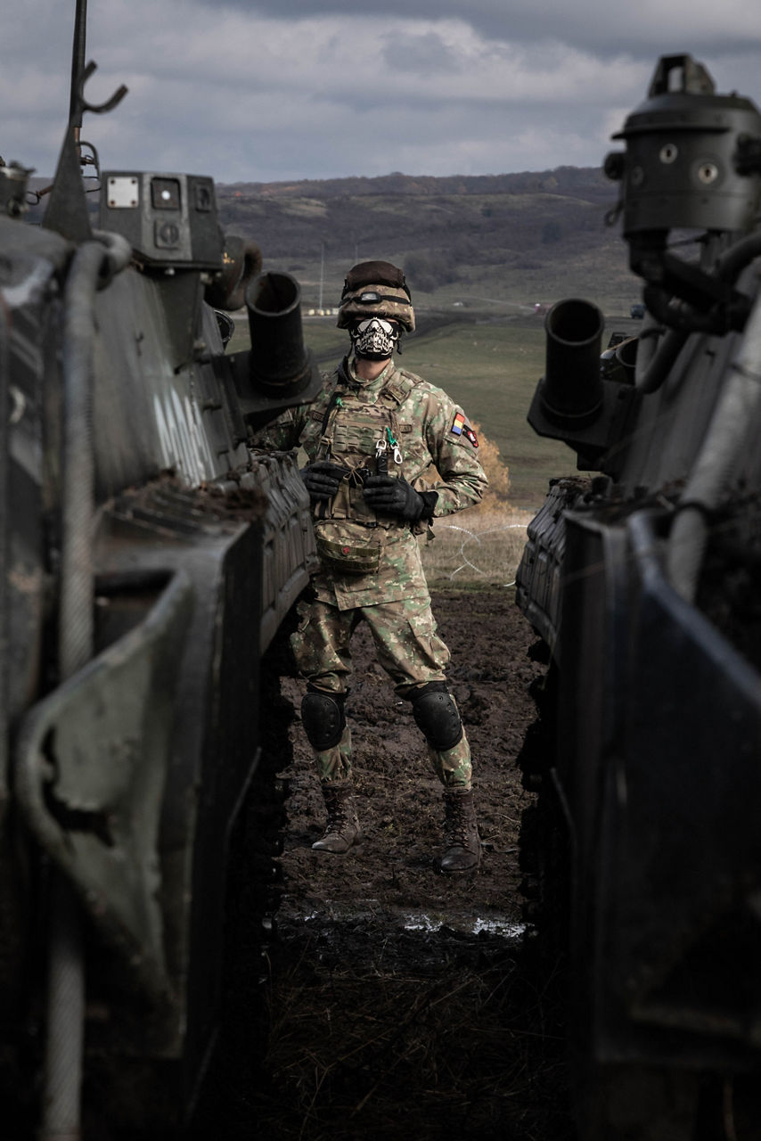A Romanian soldier stands in the gap between two parked infantry fighting vehicles during Dacian Fall 25. 

NATO forces in Romania demonstrated their ability to expand from a multinational battlegroup to an armoured brigade, quickly absorbing thousands of French Army troops as part of exercise Dacian Fall 25. The drills included troops from Belgium, Bulgaria, France, Germany, Italy, Luxembourg, North Macedonia, Poland, Portugal, Romania, Spain and the United States. It ran from 20 October to 13 November 2025.