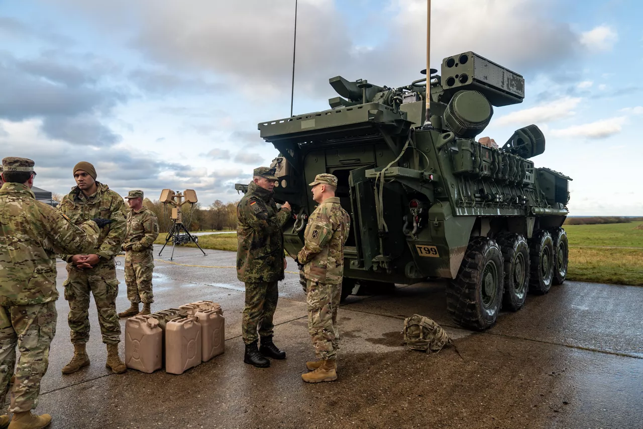 A German Army officer and a US Army officer engage in discussion in front of a US Army vehicle equipped with C-UAS (Counter-Unmanned Aerial Systems).



NATO and its Allies are boosting our defence against the threat posed by drones with various initiatives. Part of these efforts is Project Flytrap 4.5, a US-led initiative designed to test and evaluate off-the-shelf, scalable, cutting-edge counter-drone technologies, for possible fast procurement and future integration into Allied air defence systems. These tested systems can help Allies to detect and destroy drones at a lower cost and higher efficiency.

