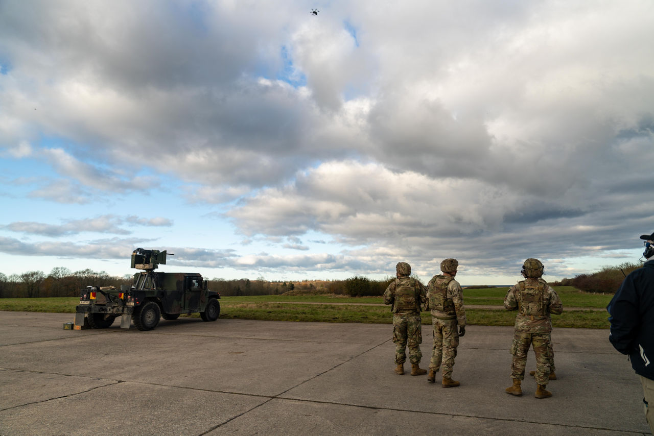 US soldiers stand nearby a US Army vehicle equipped with counter-drone technology as a small drone flies above the training ground as part of counter-drone tests.



NATO and its Allies are boosting our defence against the threat posed by drones with various initiatives. Part of these efforts is Project Flytrap 4.5, a US-led initiative designed to test and evaluate off-the-shelf, scalable, cutting-edge counter-drone technologies, for possible fast procurement and future integration into Allied air defence systems. These tested systems can help Allies to detect and destroy drones at a lower cost and higher efficiency.

