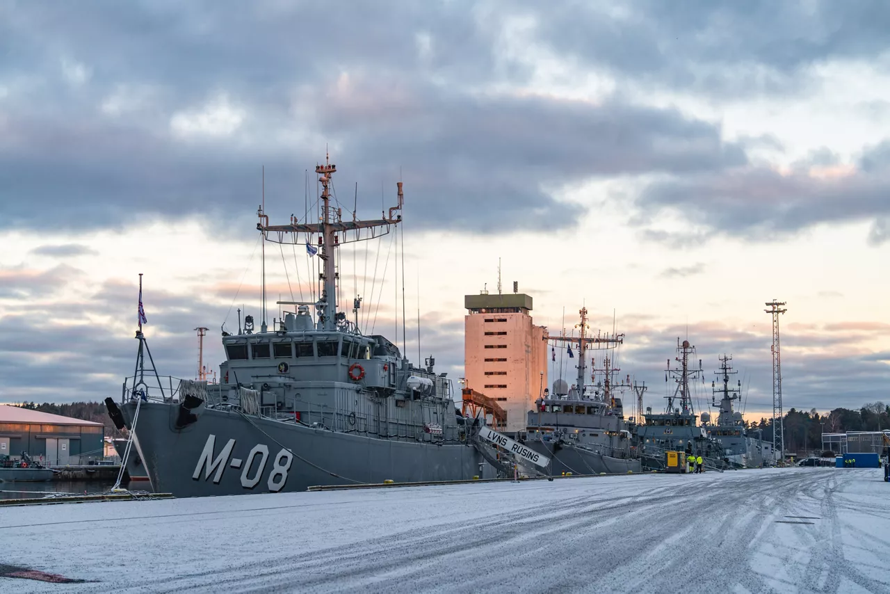 Ships from SNMCMG1 dock at the port of Turku as it prepares for exercise Freezing Winds.

NATO and its Allies are intensifying efforts to protect vital sea routes and critical infrastructure. Exercise Freezing Winds 2025 brought together ships from Standing NATO Mine Countermeasures Group One (SNMCMG1) and other Allied units to train side by side in the Baltic Sea’s harsh winter conditions. Over several days, naval forces, divers, and mine counter-measure teams practised joint operations to ensure readiness against diverse threats — from detecting and neutralising underwater threats to responding to disruptions affecting vital sea lines of communication. This exercise complements NATO’s Baltic Sentry enhanced vigilance activity, launched in January 2025 to strengthen surveillance and monitoring across the region. The exercise took place from 24 November to 4 December 2025.