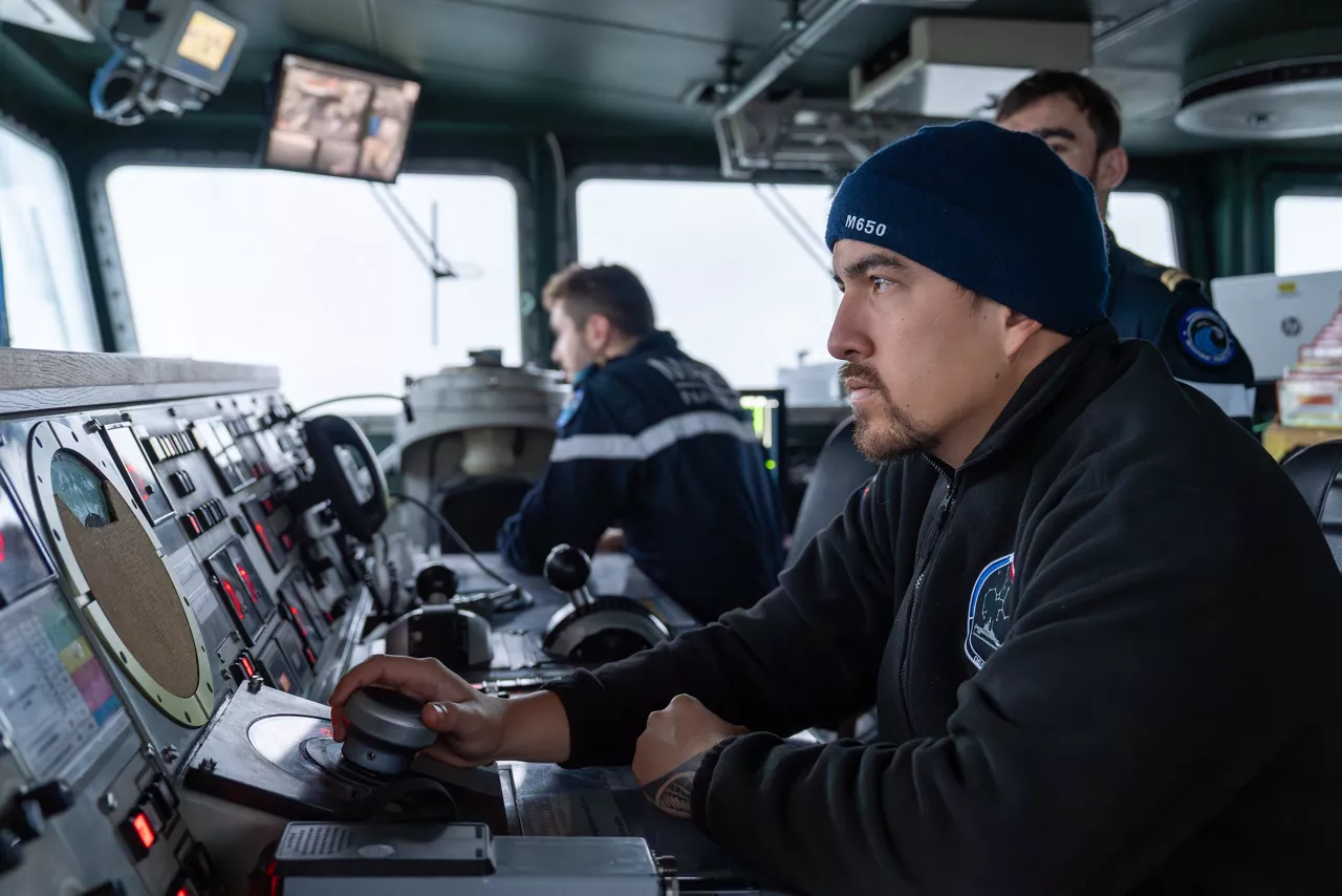 A French sailor looks out from the bridge of the French minehunter FS Sagittaire as it sails during exercise Freezing Winds.

NATO and its Allies are intensifying efforts to protect vital sea routes and critical infrastructure. Exercise Freezing Winds 2025 brought together ships from Standing NATO Mine Countermeasures Group One (SNMCMG1) and other Allied units to train side by side in the Baltic Sea’s harsh winter conditions. Over several days, naval forces, divers, and mine counter-measure teams practised joint operations to ensure readiness against diverse threats — from detecting and neutralising underwater threats to responding to disruptions affecting vital sea lines of communication. This exercise complements NATO’s Baltic Sentry enhanced vigilance activity, launched in January 2025 to strengthen surveillance and monitoring across the region. The exercise took place from 24 November to 4 December 2025.