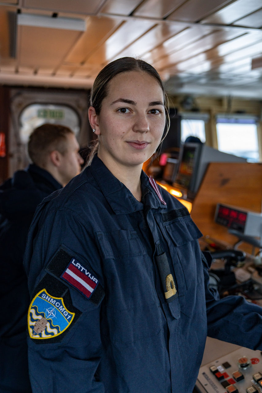 A Latvian Navy engineering officer manages the engines aboard SNMCMG1’s flagship LVNS Virsaitis during exercise Freezing Winds.

NATO and its Allies are intensifying efforts to protect vital sea routes and critical infrastructure. Exercise Freezing Winds 2025 brought together ships from Standing NATO Mine Countermeasures Group One (SNMCMG1) and other Allied units to train side by side in the Baltic Sea’s harsh winter conditions. Over several days, naval forces, divers, and mine counter-measure teams practised joint operations to ensure readiness against diverse threats — from detecting and neutralising underwater threats to responding to disruptions affecting vital sea lines of communication. This exercise complements NATO’s Baltic Sentry enhanced vigilance activity, launched in January 2025 to strengthen surveillance and monitoring across the region. The exercise took place from 24 November to 4 December 2025.
