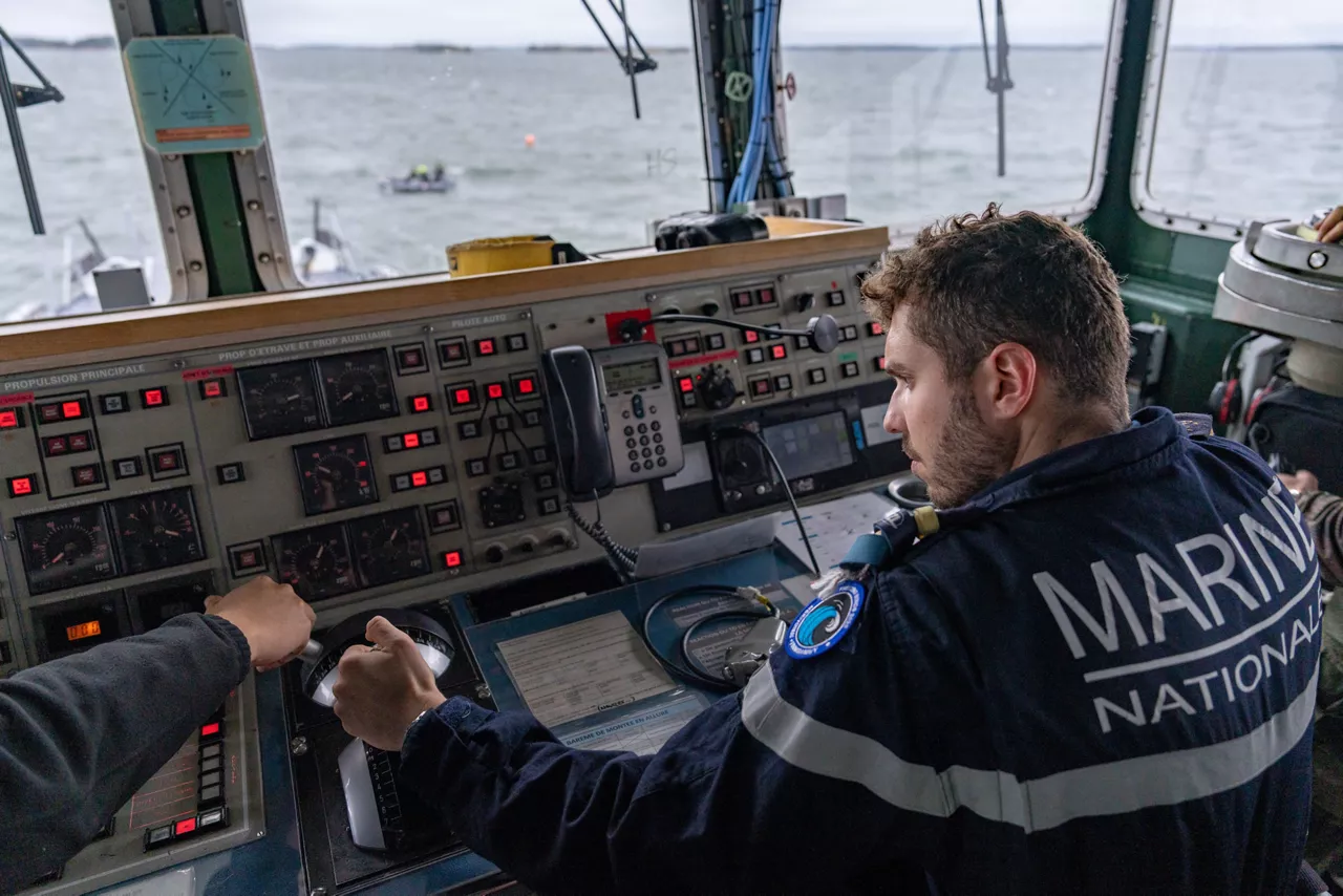 A French sailor sails the French minehunter FS Sagittaire, adjusting the controls on the bridge during exercise Freezing Winds.

NATO and its Allies are intensifying efforts to protect vital sea routes and critical infrastructure. Exercise Freezing Winds 2025 brought together ships from Standing NATO Mine Countermeasures Group One (SNMCMG1) and other Allied units to train side by side in the Baltic Sea’s harsh winter conditions. Over several days, naval forces, divers, and mine counter-measure teams practised joint operations to ensure readiness against diverse threats — from detecting and neutralising underwater threats to responding to disruptions affecting vital sea lines of communication. This exercise complements NATO’s Baltic Sentry enhanced vigilance activity, launched in January 2025 to strengthen surveillance and monitoring across the region. The exercise took place from 24 November to 4 December 2025.