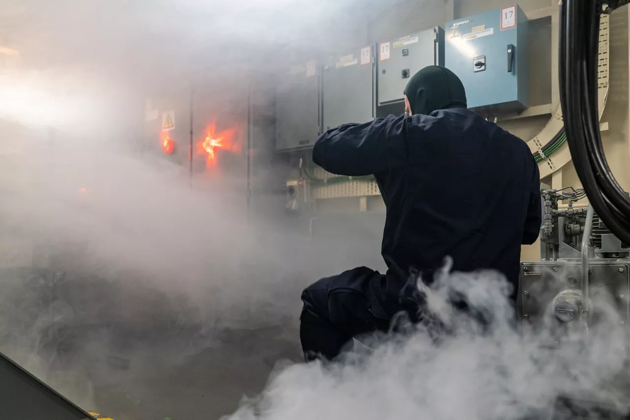 A Latvian sailor aboard SNMCMG1’s flagship LVNS Virsaitis conducts firefighting drills during exercise Freezing Winds.

NATO and its Allies are intensifying efforts to protect vital sea routes and critical infrastructure. Exercise Freezing Winds 2025 brought together ships from Standing NATO Mine Countermeasures Group One (SNMCMG1) and other Allied units to train side by side in the Baltic Sea’s harsh winter conditions. Over several days, naval forces, divers, and mine counter-measure teams practised joint operations to ensure readiness against diverse threats — from detecting and neutralising underwater threats to responding to disruptions affecting vital sea lines of communication. This exercise complements NATO’s Baltic Sentry enhanced vigilance activity, launched in January 2025 to strengthen surveillance and monitoring across the region. The exercise took place from 24 November to 4 December 2025.