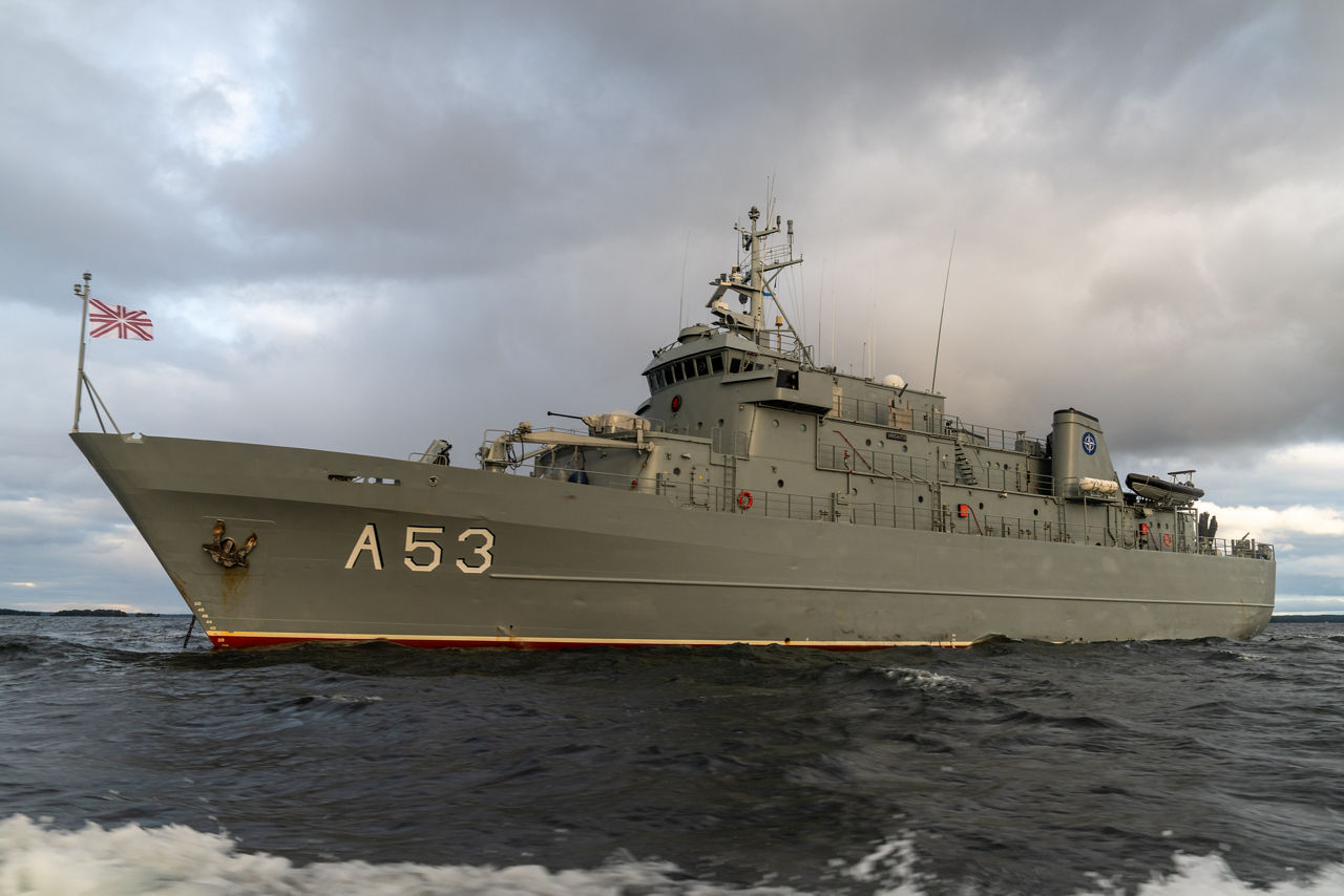 SNMCMG1’s flagship LVNS Virsaitis sails through the Baltic Sea during exercise Freezing Winds.

NATO and its Allies are intensifying efforts to protect vital sea routes and critical infrastructure. Exercise Freezing Winds 2025 brought together ships from Standing NATO Mine Countermeasures Group One (SNMCMG1) and other Allied units to train side by side in the Baltic Sea’s harsh winter conditions. Over several days, naval forces, divers, and mine counter-measure teams practised joint operations to ensure readiness against diverse threats — from detecting and neutralising underwater threats to responding to disruptions affecting vital sea lines of communication. This exercise complements NATO’s Baltic Sentry enhanced vigilance activity, launched in January 2025 to strengthen surveillance and monitoring across the region. The exercise took place from 24 November to 4 December 2025.