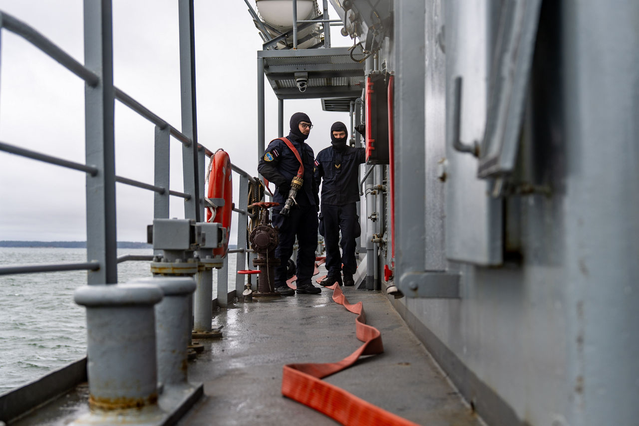 Latvian sailors aboard SNMCMG1’s flagship LVNS Virsaitis conduct firefighting drills during exercise Freezing Winds.

NATO and its Allies are intensifying efforts to protect vital sea routes and critical infrastructure. Exercise Freezing Winds 2025 brought together ships from Standing NATO Mine Countermeasures Group One (SNMCMG1) and other Allied units to train side by side in the Baltic Sea’s harsh winter conditions. Over several days, naval forces, divers, and mine counter-measure teams practised joint operations to ensure readiness against diverse threats — from detecting and neutralising underwater threats to responding to disruptions affecting vital sea lines of communication. This exercise complements NATO’s Baltic Sentry enhanced vigilance activity, launched in January 2025 to strengthen surveillance and monitoring across the region. The exercise took place from 24 November to 4 December 2025.