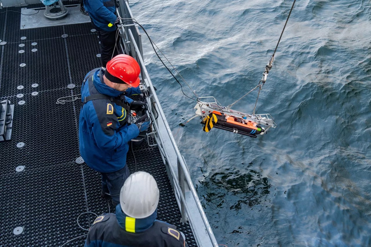 German sailors aboard the minehunter FGS Dillingen deploy an underwater drone for mine countermeasure operations during NATO exercise Freezing Winds in the Baltic Sea.

NATO and its Allies are intensifying efforts to protect vital sea routes and critical infrastructure. Exercise Freezing Winds 2025 brought together ships from Standing NATO Mine Countermeasures Group One (SNMCMG1) and other Allied units to train side by side in the Baltic Sea’s harsh winter conditions. Over several days, naval forces, divers, and mine counter-measure teams practised joint operations to ensure readiness against diverse threats — from detecting and neutralising underwater threats to responding to disruptions affecting vital sea lines of communication. This exercise complements NATO’s Baltic Sentry enhanced vigilance activity, launched in January 2025 to strengthen surveillance and monitoring across the region. The exercise took place from 24 November to 4 December 2025.