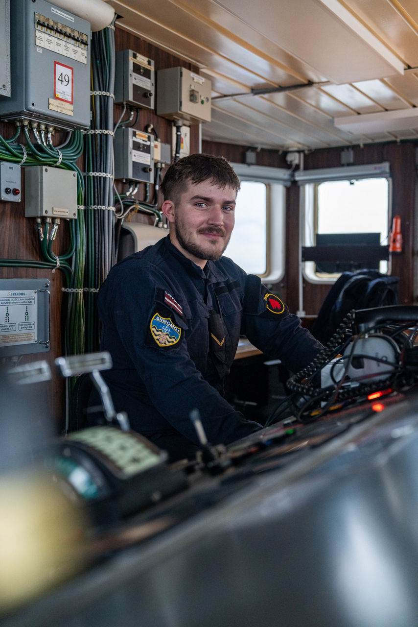 A Latvian sailor aboard SNMCMG1’s flagship LVNS Virsaitis looks toward the camera while sailing during exercise Freezing Winds.

NATO and its Allies are intensifying efforts to protect vital sea routes and critical infrastructure. Exercise Freezing Winds 2025 brought together ships from Standing NATO Mine Countermeasures Group One (SNMCMG1) and other Allied units to train side by side in the Baltic Sea’s harsh winter conditions. Over several days, naval forces, divers, and mine counter-measure teams practised joint operations to ensure readiness against diverse threats — from detecting and neutralising underwater threats to responding to disruptions affecting vital sea lines of communication. This exercise complements NATO’s Baltic Sentry enhanced vigilance activity, launched in January 2025 to strengthen surveillance and monitoring across the region. The exercise took place from 24 November to 4 December 2025.