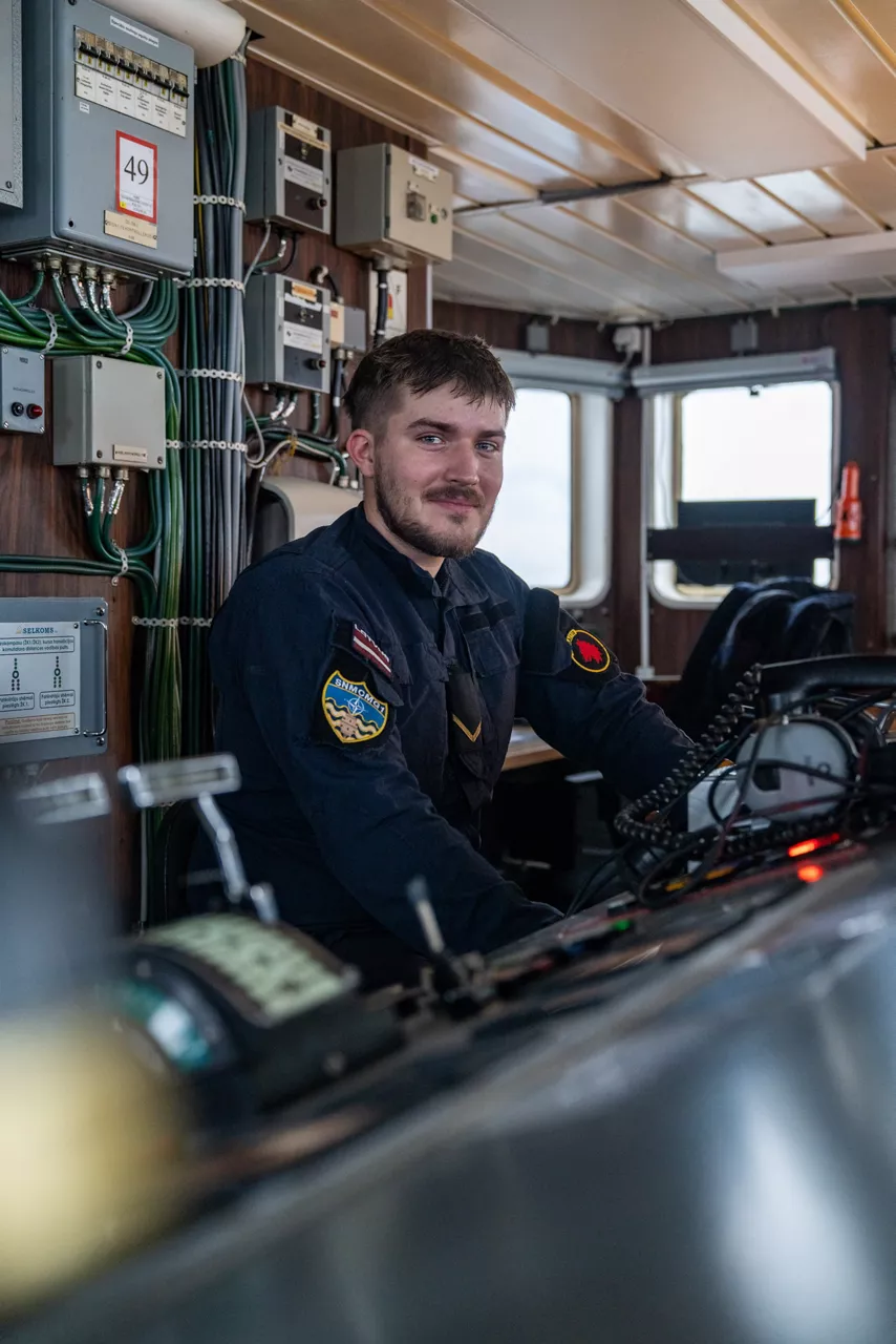 A Latvian sailor aboard SNMCMG1’s flagship LVNS Virsaitis looks toward the camera while sailing during exercise Freezing Winds.

NATO and its Allies are intensifying efforts to protect vital sea routes and critical infrastructure. Exercise Freezing Winds 2025 brought together ships from Standing NATO Mine Countermeasures Group One (SNMCMG1) and other Allied units to train side by side in the Baltic Sea’s harsh winter conditions. Over several days, naval forces, divers, and mine counter-measure teams practised joint operations to ensure readiness against diverse threats — from detecting and neutralising underwater threats to responding to disruptions affecting vital sea lines of communication. This exercise complements NATO’s Baltic Sentry enhanced vigilance activity, launched in January 2025 to strengthen surveillance and monitoring across the region. The exercise took place from 24 November to 4 December 2025.
