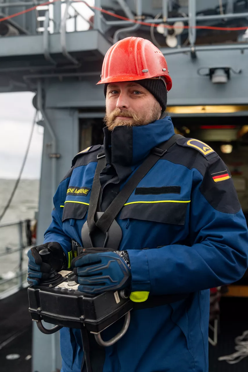A German sailor aboard the minehunter FGS Dillingen poses for a photo after deploying an underwater drone for mine countermeasure operations during exercise Freezing Winds.

NATO and its Allies are intensifying efforts to protect vital sea routes and critical infrastructure. Exercise Freezing Winds 2025 brought together ships from Standing NATO Mine Countermeasures Group One (SNMCMG1) and other Allied units to train side by side in the Baltic Sea’s harsh winter conditions. Over several days, naval forces, divers, and mine counter-measure teams practised joint operations to ensure readiness against diverse threats — from detecting and neutralising underwater threats to responding to disruptions affecting vital sea lines of communication. This exercise complements NATO’s Baltic Sentry enhanced vigilance activity, launched in January 2025 to strengthen surveillance and monitoring across the region. The exercise took place from 24 November to 4 December 2025.