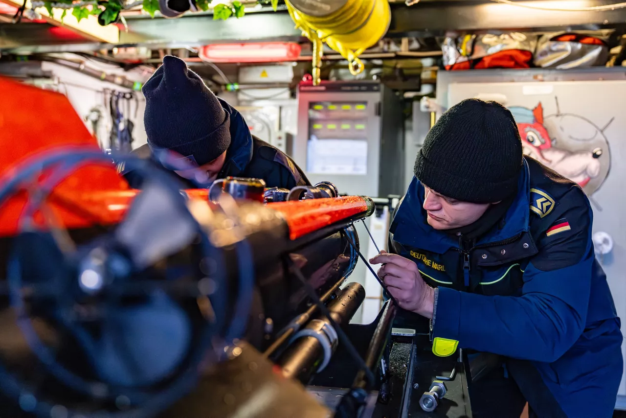 German sailors aboard the minehunter FGS Dillingen maintain an underwater drone after mine countermeasure operations during exercise Freezing Winds.

NATO and its Allies are intensifying efforts to protect vital sea routes and critical infrastructure. Exercise Freezing Winds 2025 brought together ships from Standing NATO Mine Countermeasures Group One (SNMCMG1) and other Allied units to train side by side in the Baltic Sea’s harsh winter conditions. Over several days, naval forces, divers, and mine counter-measure teams practised joint operations to ensure readiness against diverse threats — from detecting and neutralising underwater threats to responding to disruptions affecting vital sea lines of communication. This exercise complements NATO’s Baltic Sentry enhanced vigilance activity, launched in January 2025 to strengthen surveillance and monitoring across the region. The exercise took place from 24 November to 4 December 2025.