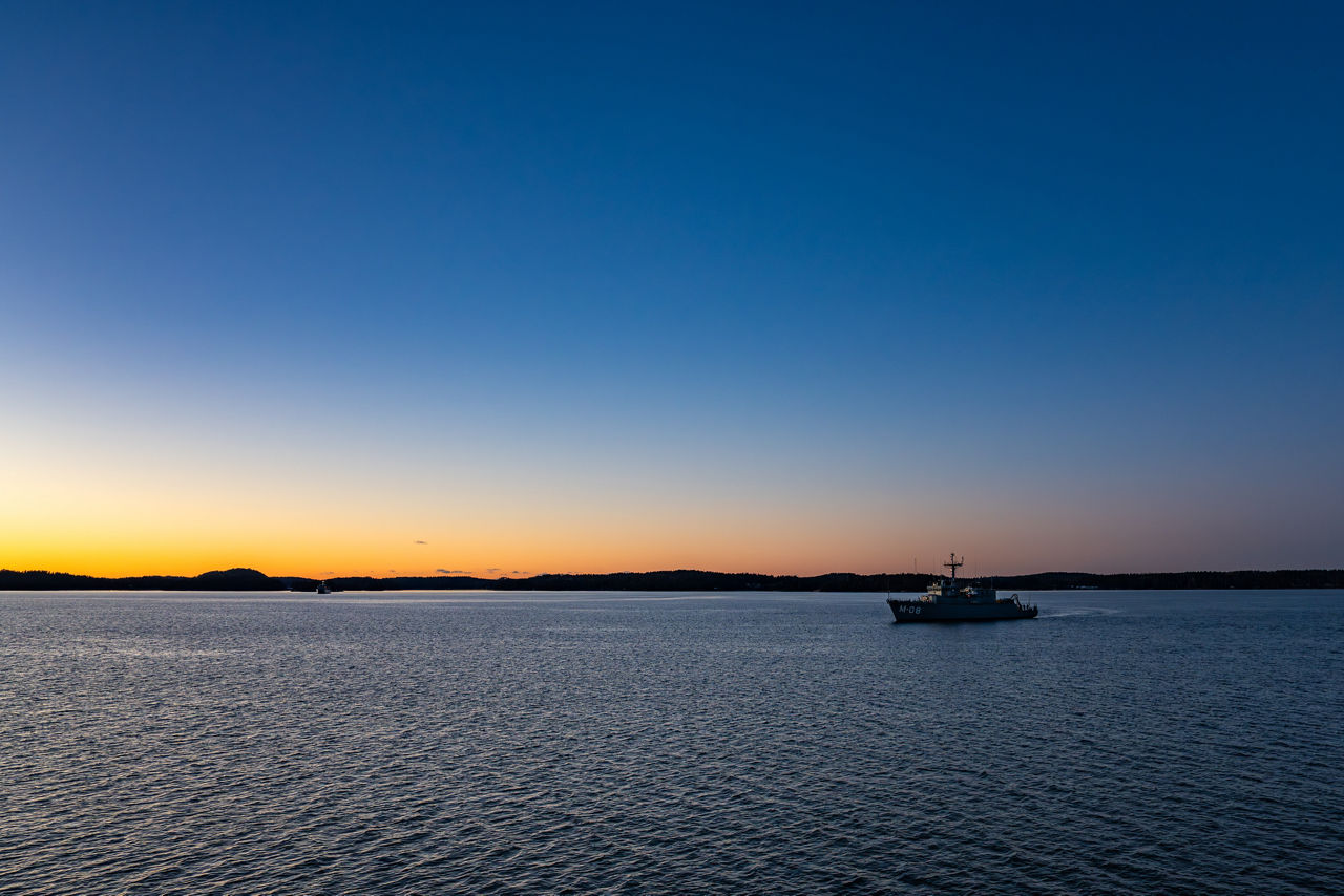 Latvian minehunter LVNS Rūsiņš sails across the Archipelago Sea as the sun sets.

NATO and its Allies are intensifying efforts to protect vital sea routes and critical infrastructure. Exercise Freezing Winds 2025 brought together ships from Standing NATO Mine Countermeasures Group One (SNMCMG1) and other Allied units to train side by side in the Baltic Sea’s harsh winter conditions. Over several days, naval forces, divers, and mine counter-measure teams practised joint operations to ensure readiness against diverse threats — from detecting and neutralising underwater threats to responding to disruptions affecting vital sea lines of communication. This exercise complements NATO’s Baltic Sentry enhanced vigilance activity, launched in January 2025 to strengthen surveillance and monitoring across the region. The exercise took place from 24 November to 4 December 2025.