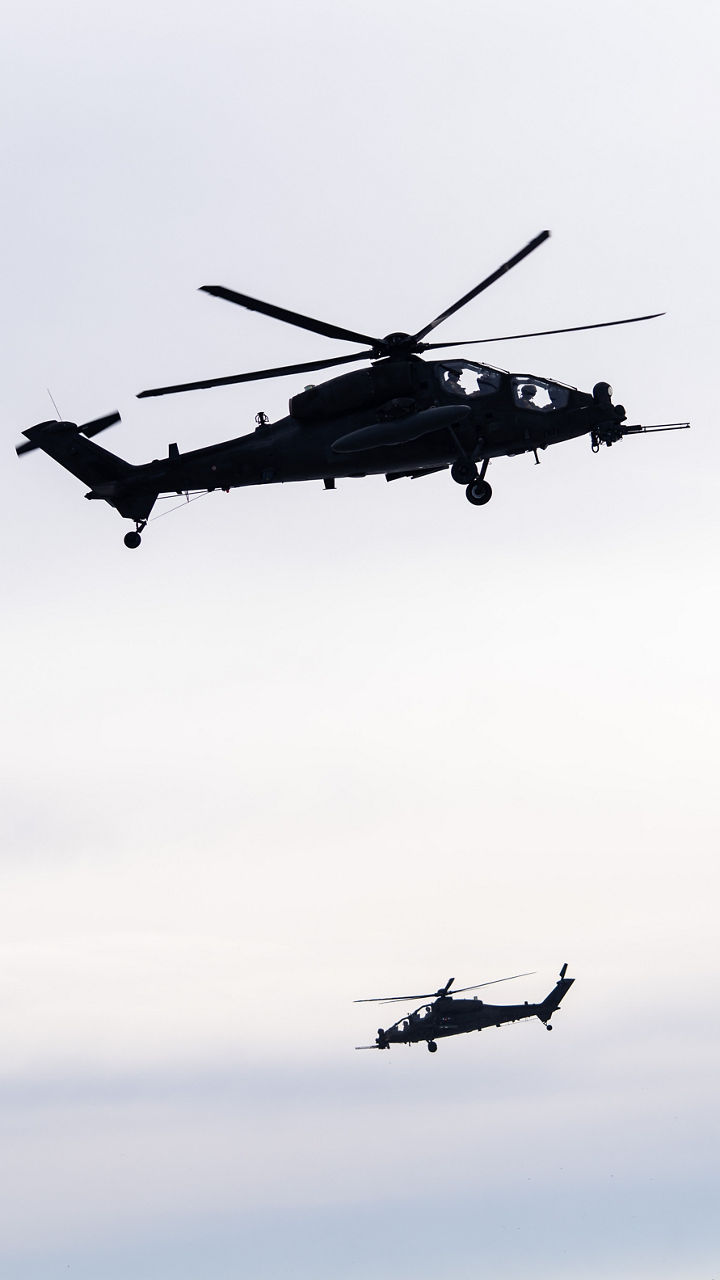 Italian attack helicopters hover in position during exercise Steadfast Dart 26.

Between January and March, around 10,000 troops from 13 NATO Allies deployed across Europe for exercise Steadfast Dart 26 — the Alliance’s largest and most visible drill of the year. The exercise brought together 17 naval vessels, more than 20 aircraft and roughly 1,500 military vehicles in Germany, testing NATO’s rapid reinforcement and coordination across land, air, sea and cyber domains.