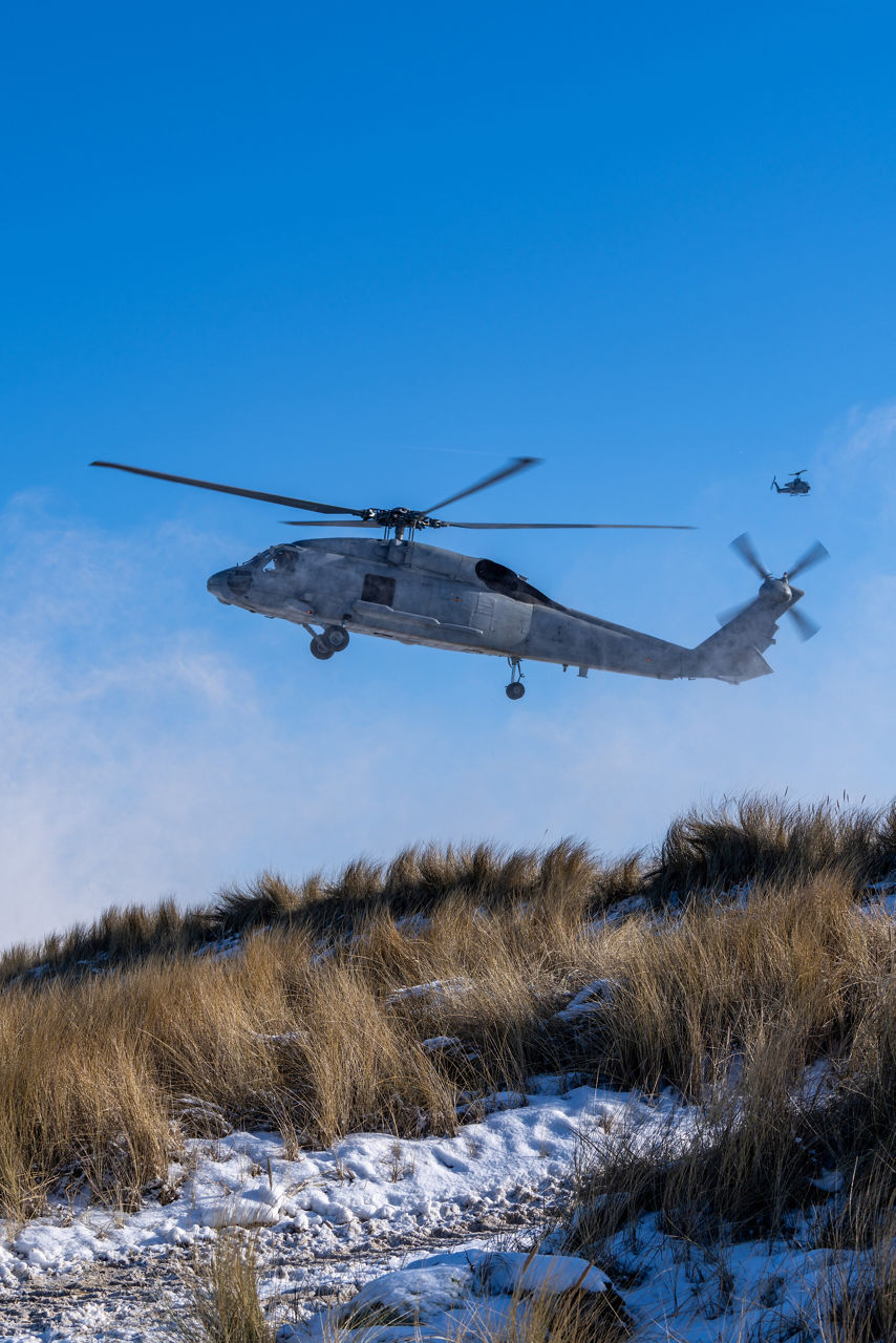Spanish Seahawk helicopters hold a steady hover while preparing to insert troops via fast‑roping during amphibious operations in exercise Steadfast Dart 26.

Between January and March, around 10,000 troops from 13 NATO Allies deployed across Europe for exercise Steadfast Dart 26 — the Alliance’s largest and most visible drill of the year. The exercise brought together 17 naval vessels, more than 20 aircraft and roughly 1,500 military vehicles in Germany, testing NATO’s rapid reinforcement and coordination across land, air, sea and cyber domains.