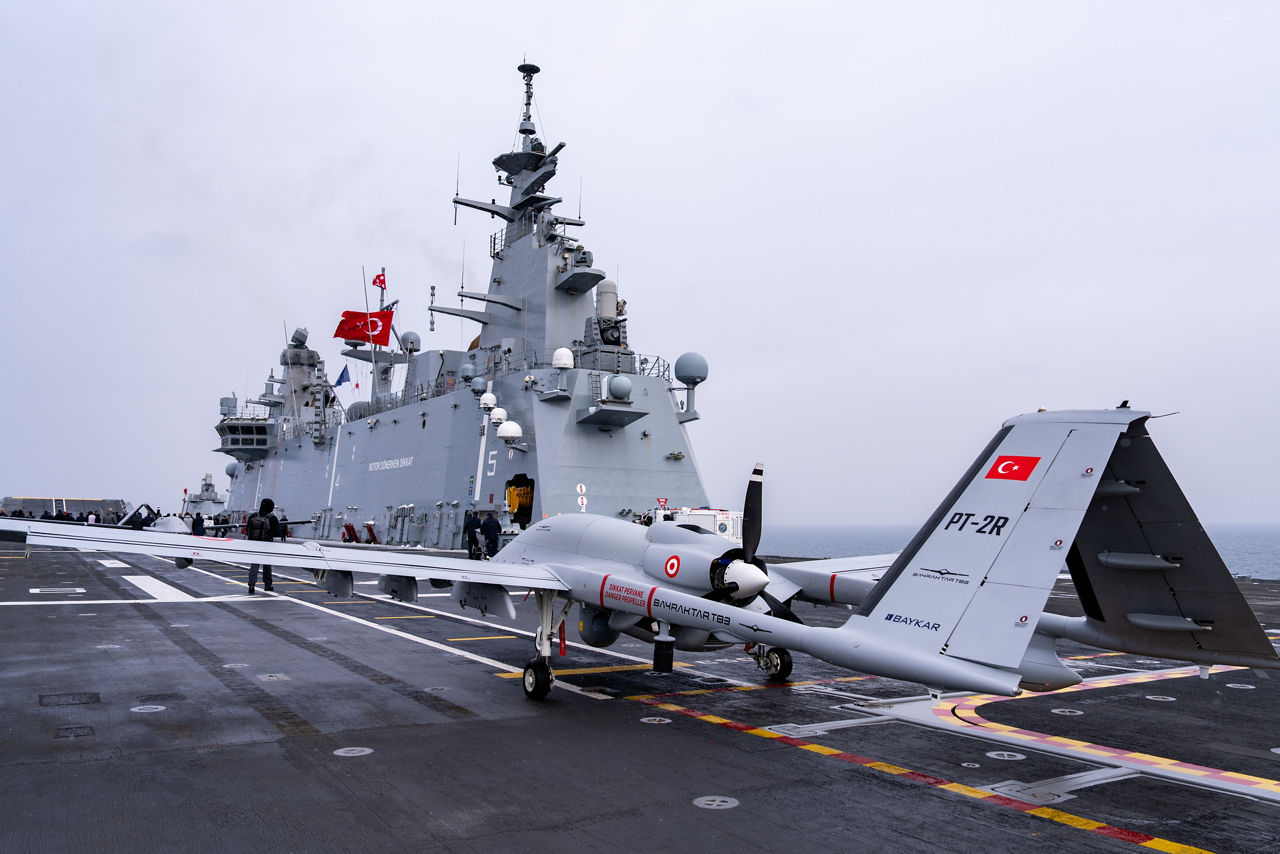 A Turkish TB3 drone lines the flight deck of TCG Anadolu.

Between January and March, around 10,000 troops from 13 NATO Allies deployed across Europe for exercise Steadfast Dart 26 — the Alliance’s largest and most visible drill of the year. The exercise brought together 17 naval vessels, more than 20 aircraft and roughly 1,500 military vehicles in Germany, testing NATO’s rapid reinforcement and coordination across land, air, sea and cyber domains.
