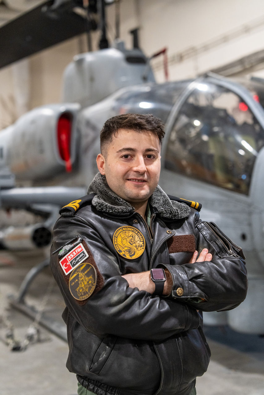A Turkish helicopter pilot smiles to the camera while on board TCG Anadolu during exercise Steadfast Dart 26.

Between January and March, around 10,000 troops from 13 NATO Allies deployed across Europe for exercise Steadfast Dart 26 — the Alliance’s largest and most visible drill of the year. The exercise brought together 17 naval vessels, more than 20 aircraft and roughly 1,500 military vehicles in Germany, testing NATO’s rapid reinforcement and coordination across land, air, sea and cyber domains.