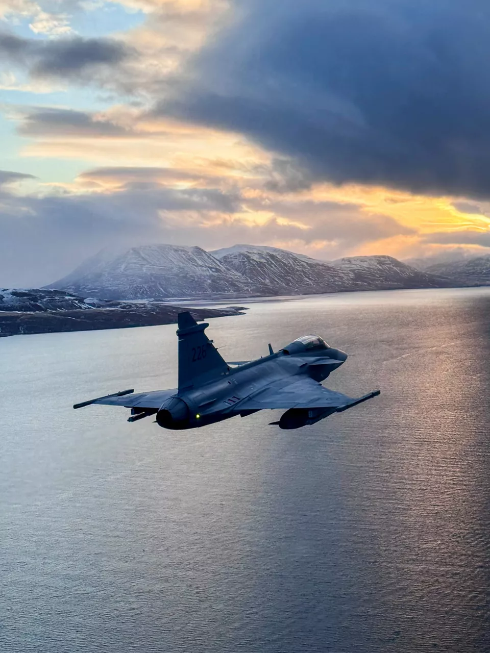 A Swedish Air Force JAS 39 Gripen fighter cruises over an Icelandic fjord while deployed as part of NATO’s Arctic Sentry activity. Arctic Sentry is a NATO vigilance activity aimed at enhancing security in the north, helping to make the Alliance safer. As part of this initiative, Sweden deployed a detachment of six Gripens to Keflavik Air Base to safeguard Icelandic airspace against threats or intrusions. Their deployment is also part of NATO’s Iceland Air Policing mission, marking the first time Sweden has led an air policing mission since joining NATO two years ago as its 32nd member. Situated in the middle of the North Atlantic, Iceland plays a vital role in helping Allies maintain situational awareness in the High North. Photo courtesy of the Swedish Air Force.
