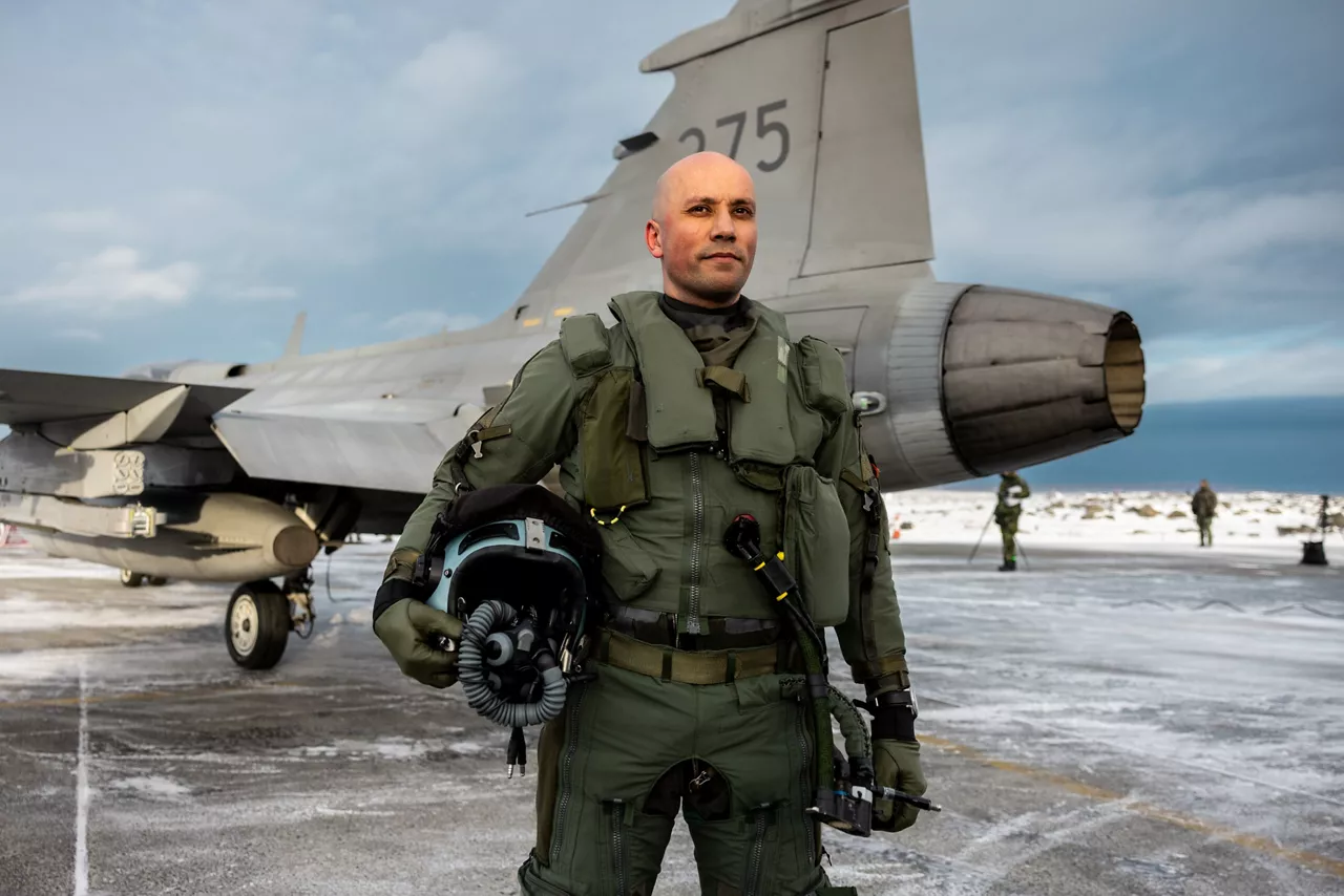 A Swedish Air Force fighter pilot stands by his JAS 39 Gripen fighter at Keflavik Air Base in Iceland while deployed as part of NATO’s Arctic Sentry activity. Arctic Sentry is a NATO vigilance activity aimed at enhancing security in the north, helping to make the Alliance safer. As part of this initiative, Sweden deployed a detachment of six Gripens to Keflavik Air Base to safeguard Icelandic airspace against threats or intrusions. Their deployment is also part of NATO’s Iceland Air Policing mission, marking the first time Sweden has led an air policing mission since joining NATO two years ago as its 32nd member. Situated in the middle of the North Atlantic, Iceland plays a vital role in helping Allies maintain situational awareness in the High North.
