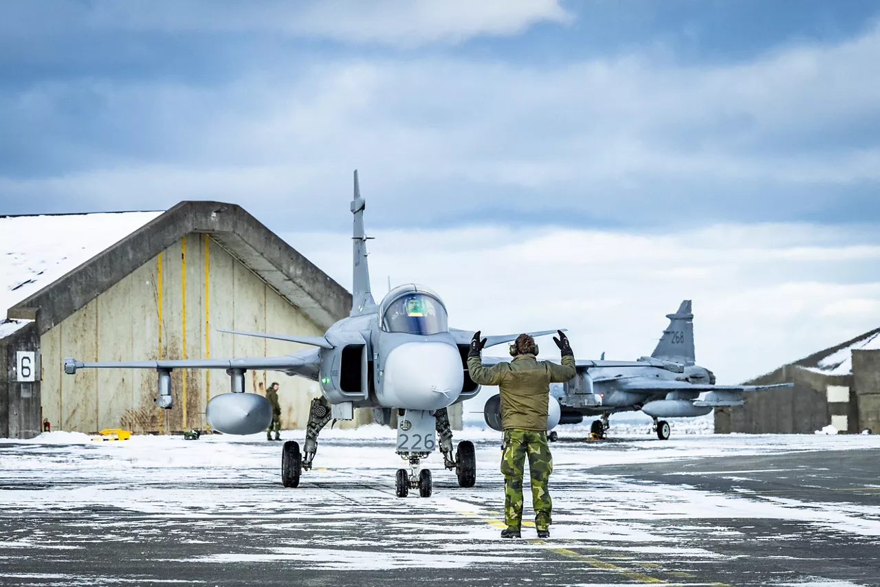 A Swedish Air Force JAS 39 Gripen fighter comes to a halt outside a hardened aircraft shelter at Keflavik Air Base in Iceland while deployed as part of NATO’s Arctic Sentry activity. Arctic Sentry is a NATO vigilance activity aimed at enhancing security in the north, helping to make the Alliance safer. As part of this initiative, Sweden deployed a detachment of six Gripens to Keflavik Air Base to safeguard Icelandic airspace against threats or intrusions. Their deployment is also part of NATO’s Iceland Air Policing mission, marking the first time Sweden has led an air policing mission since joining NATO two years ago as its 32nd member. Situated in the middle of the North Atlantic, Iceland plays a vital role in helping Allies maintain situational awareness in the High North. Photo courtesy of NATO Allied Air Command.