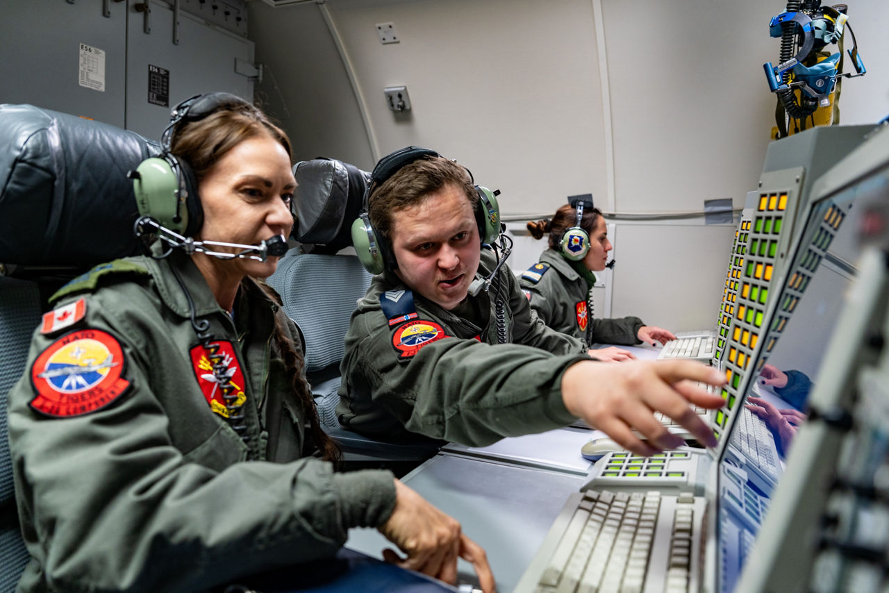 Aircrew from Canada, Denmark and Italy monitor the skies from aboard a NATO E‑3A Airborne Warning and Control System (AWACS) aircraft.

NATO’s Airborne Warning and Control System (AWACS) launched its first surveillance flight over the Barents Sea on 6 March 2026 in support of the enhanced vigilance activity “Arctic Sentry.” Arctic Sentry brings together exercises, troops and capabilities from several NATO Allies across the Arctic and the High North. By boosting surveillance and sharpening joint readiness, ”Arctic Sentry”  helps ensure that NATO and Allies can respond together to challenges in one of the world’s most strategically important regions.