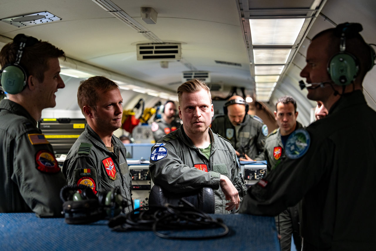 Aircrew from Belgium, Finland and the United States discuss the mission on board a NATO E‑3A Airborne Warning and Control System (AWACS) aircraft.

NATO’s Airborne Warning and Control System (AWACS) launched its first surveillance flight over the Barents Sea on 6 March 2026 in support of the enhanced vigilance activity “Arctic Sentry.” Arctic Sentry brings together exercises, troops and capabilities from several NATO Allies across the Arctic and the High North. By boosting surveillance and sharpening joint readiness, ”Arctic Sentry”  helps ensure that NATO and Allies can respond together to challenges in one of the world’s most strategically important regions.