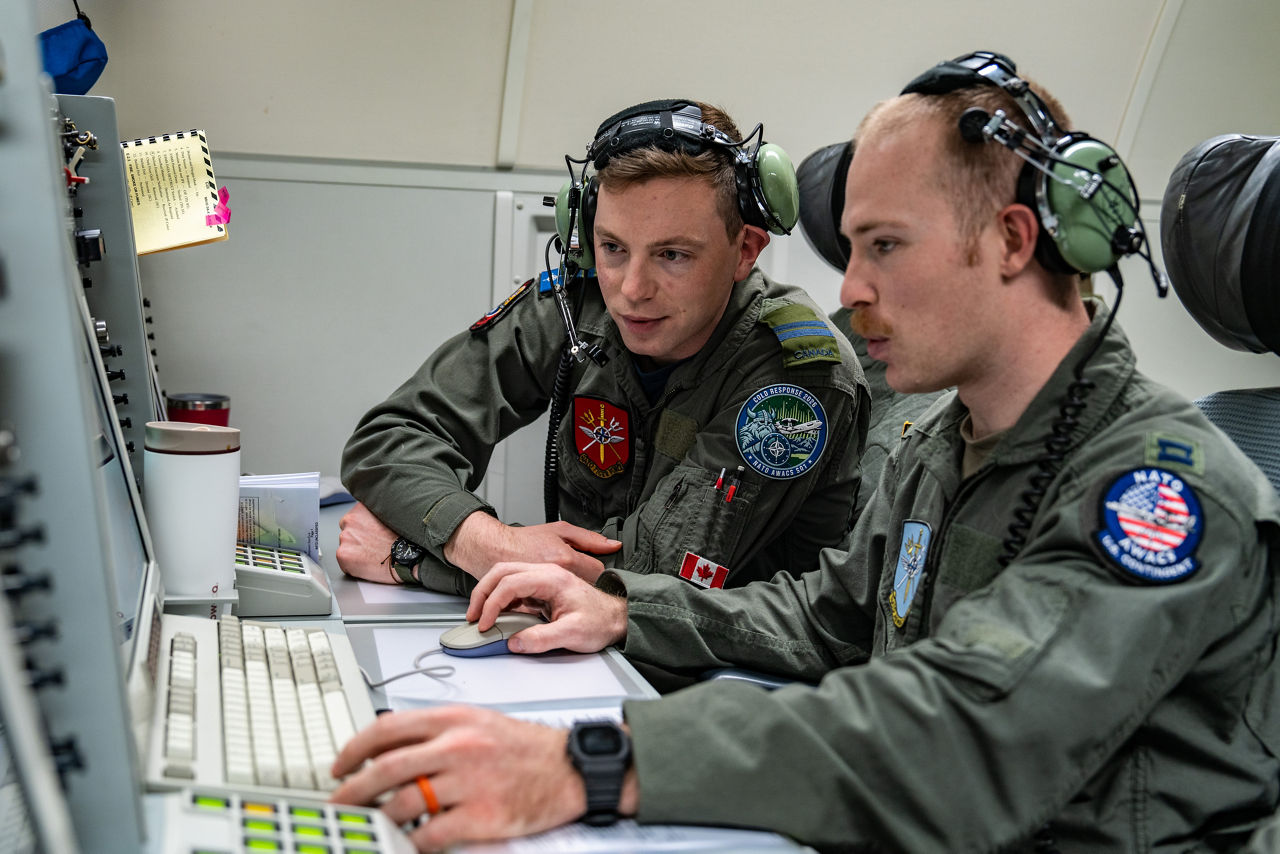 Aircrew from Canada and the United States monitor the skies aboard a NATO E‑3A Airborne Warning and Control System (AWACS) aircraft.

NATO’s Airborne Warning and Control System (AWACS) launched its first surveillance flight over the Barents Sea on 6 March 2026 in support of the enhanced vigilance activity “Arctic Sentry.” Arctic Sentry brings together exercises, troops and capabilities from several NATO Allies across the Arctic and the High North. By boosting surveillance and sharpening joint readiness, ”Arctic Sentry”  helps ensure that NATO and Allies can respond together to challenges in one of the world’s most strategically important regions.