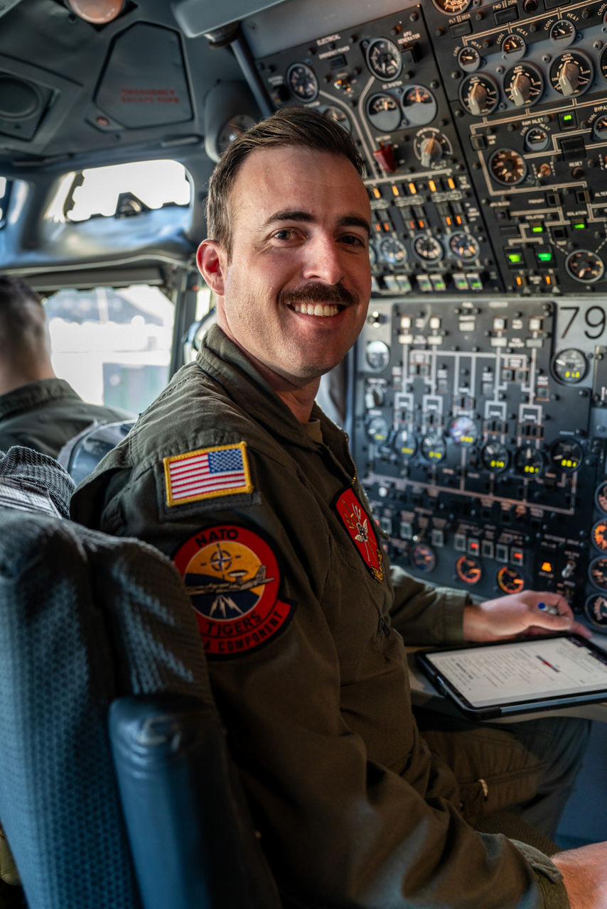 A United States Air Force flight engineer smiles to the camera aboard a NATO E‑3A Airborne Warning and Control System (AWACS) aircraft.

NATO’s Airborne Warning and Control System (AWACS) launched its first surveillance flight over the Barents Sea on 6 March 2026 in support of the enhanced vigilance activity “Arctic Sentry.” Arctic Sentry brings together exercises, troops and capabilities from several NATO Allies across the Arctic and the High North. By boosting surveillance and sharpening joint readiness, ”Arctic Sentry”  helps ensure that NATO and Allies can respond together to challenges in one of the world’s most strategically important regions.