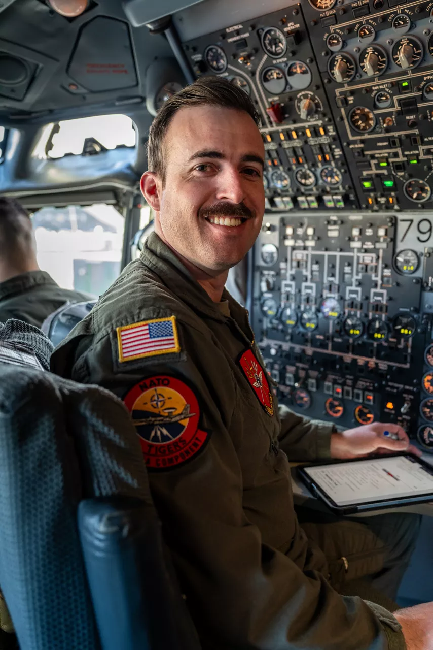 A United States Air Force flight engineer smiles to the camera aboard a NATO E‑3A Airborne Warning and Control System (AWACS) aircraft.

NATO’s Airborne Warning and Control System (AWACS) launched its first surveillance flight over the Barents Sea on 6 March 2026 in support of the enhanced vigilance activity “Arctic Sentry.” Arctic Sentry brings together exercises, troops and capabilities from several NATO Allies across the Arctic and the High North. By boosting surveillance and sharpening joint readiness, ”Arctic Sentry”  helps ensure that NATO and Allies can respond together to challenges in one of the world’s most strategically important regions.