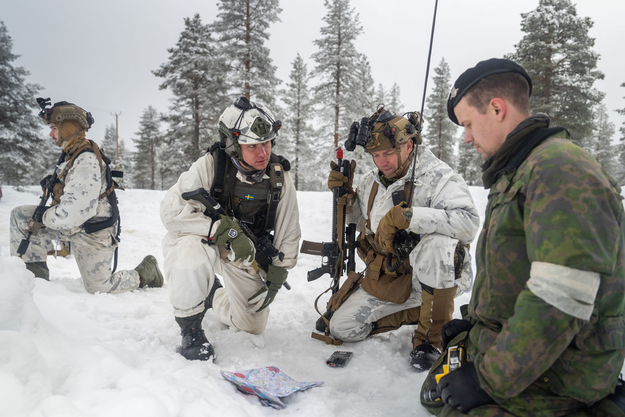 US Marines and a Swedish soldier discuss tactics to defend their position while operating in snowy terrain.

Exercise Cold Response 2026 brought together more than 32,000 troops from 14 Allied nations for intensive training above the Arctic circle in Norway and Finland. In Lapland, Finland, soldiers trained side‑by‑side to reinforce defensive positions and carry out tasks that test their endurance and teamwork in an environment where freezing temperatures, deep snow and long distances make every movement a challenge. Working together in these tough conditions helps Allies improve coordination, build trust and stay ready to work together in the harsh Arctic conditions, whenever needed. Cold Response is part of NATO’s recently established vigilance activity Arctic Sentry, dedicated to the defence and security of the High North and the Arctic.