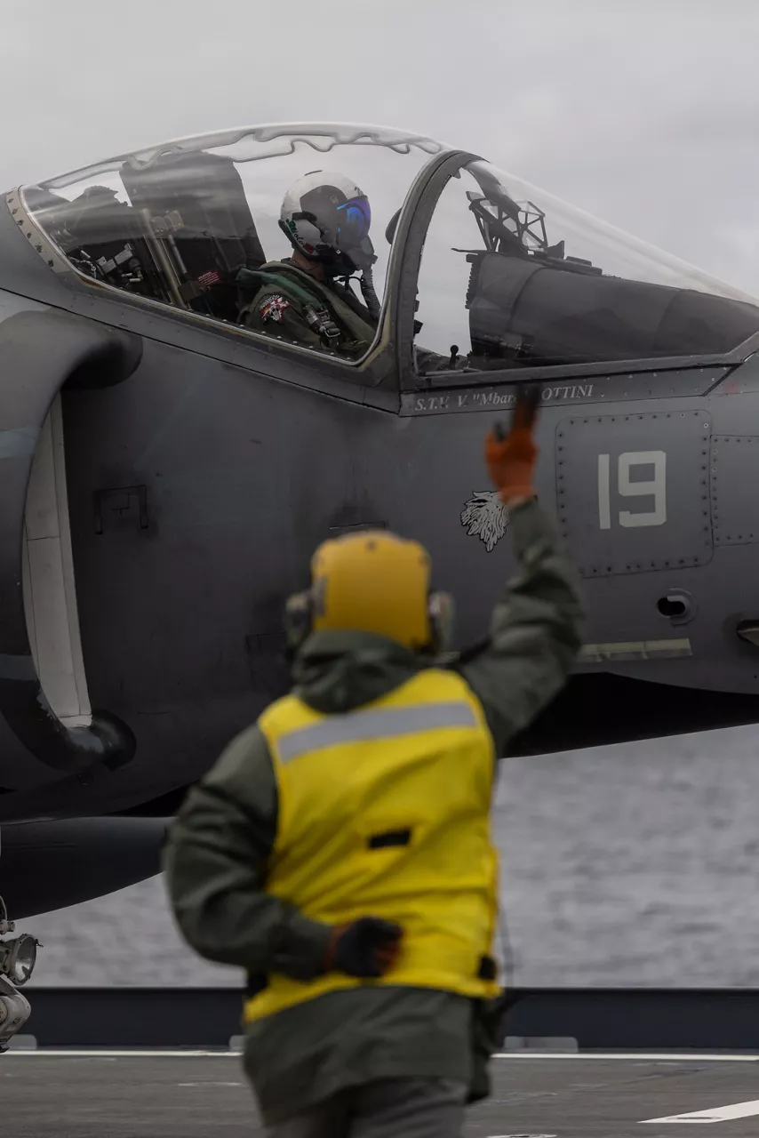 An Italian Navy sailor prepares to launch an AV-8B Harrier II off the aircraft carrier ITS Cavour during Neptune Strike, an enhanced Vigilance Activity taking place in the Western and Central Mediterranean Sea from 25 March to 1 April 2026. Naval Striking and Support Forces NATO (STRIKFORNATO), a Portugal-based maritime command, leads several Neptune Strike iterations every year, focusing on improving Allied integration at sea while expanding our presence and awareness. This iteration involved Carrier Strike Groups from France, Italy and Spain.