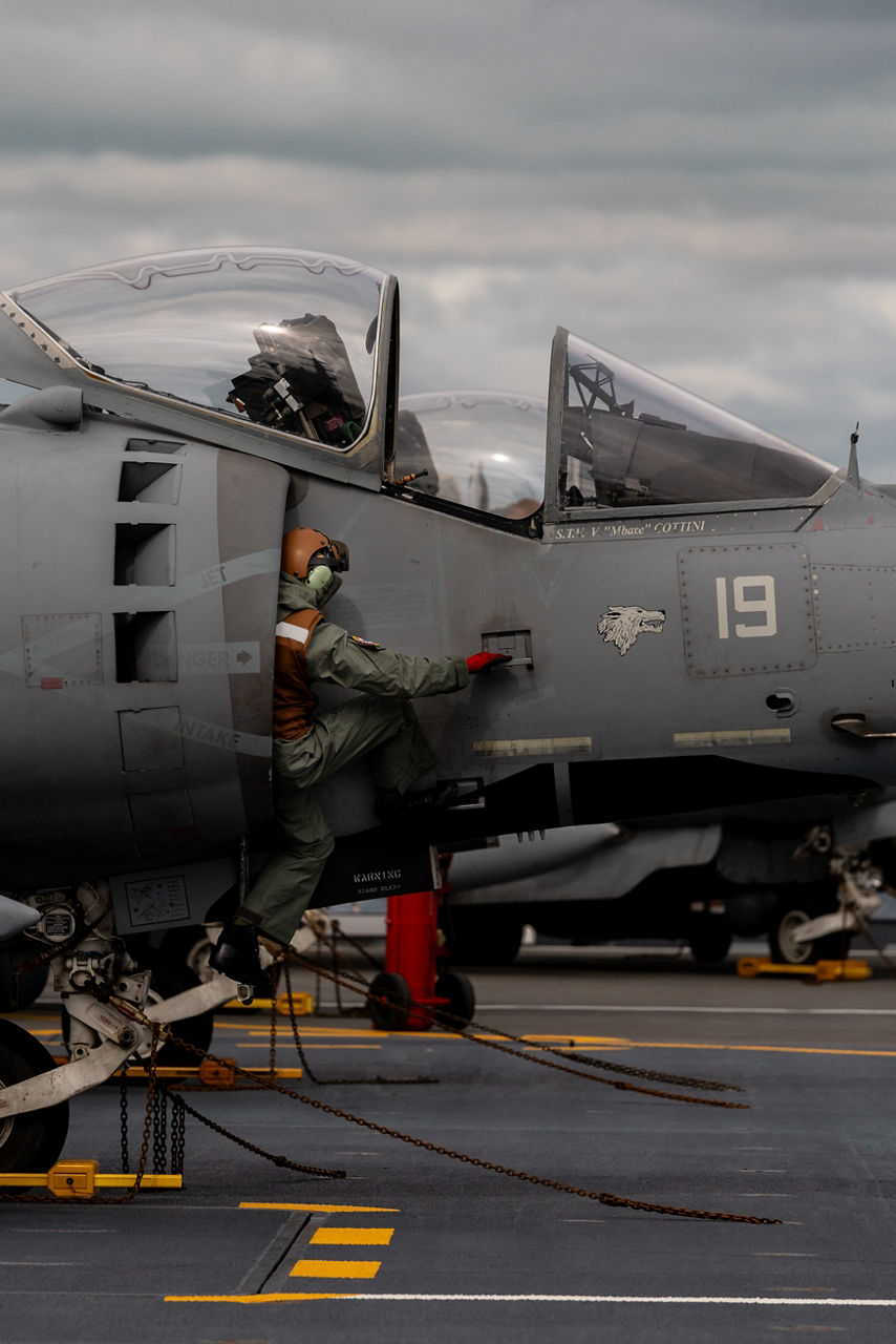 An Italian Navy aircraft maintainer climbs out of the air intake of an AV-8B Harrier II aboard the aircraft carrier ITS Cavour during Neptune Strike, an enhanced Vigilance Activity taking place in the Western and Central Mediterranean Sea from 25 March to 1 April 2026. Naval Striking and Support Forces NATO (STRIKFORNATO), a Portugal-based maritime command, leads several Neptune Strike iterations every year, focusing on improving Allied integration at sea while expanding our presence and awareness. This iteration involved Carrier Strike Groups from France, Italy and Spain.