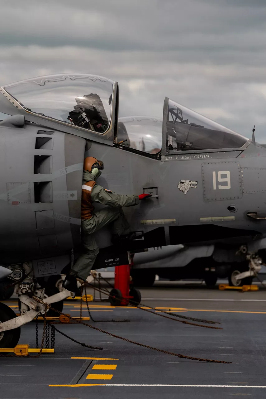 An Italian Navy aircraft maintainer climbs out of the air intake of an AV-8B Harrier II aboard the aircraft carrier ITS Cavour during Neptune Strike, an enhanced Vigilance Activity taking place in the Western and Central Mediterranean Sea from 25 March to 1 April 2026. Naval Striking and Support Forces NATO (STRIKFORNATO), a Portugal-based maritime command, leads several Neptune Strike iterations every year, focusing on improving Allied integration at sea while expanding our presence and awareness. This iteration involved Carrier Strike Groups from France, Italy and Spain.