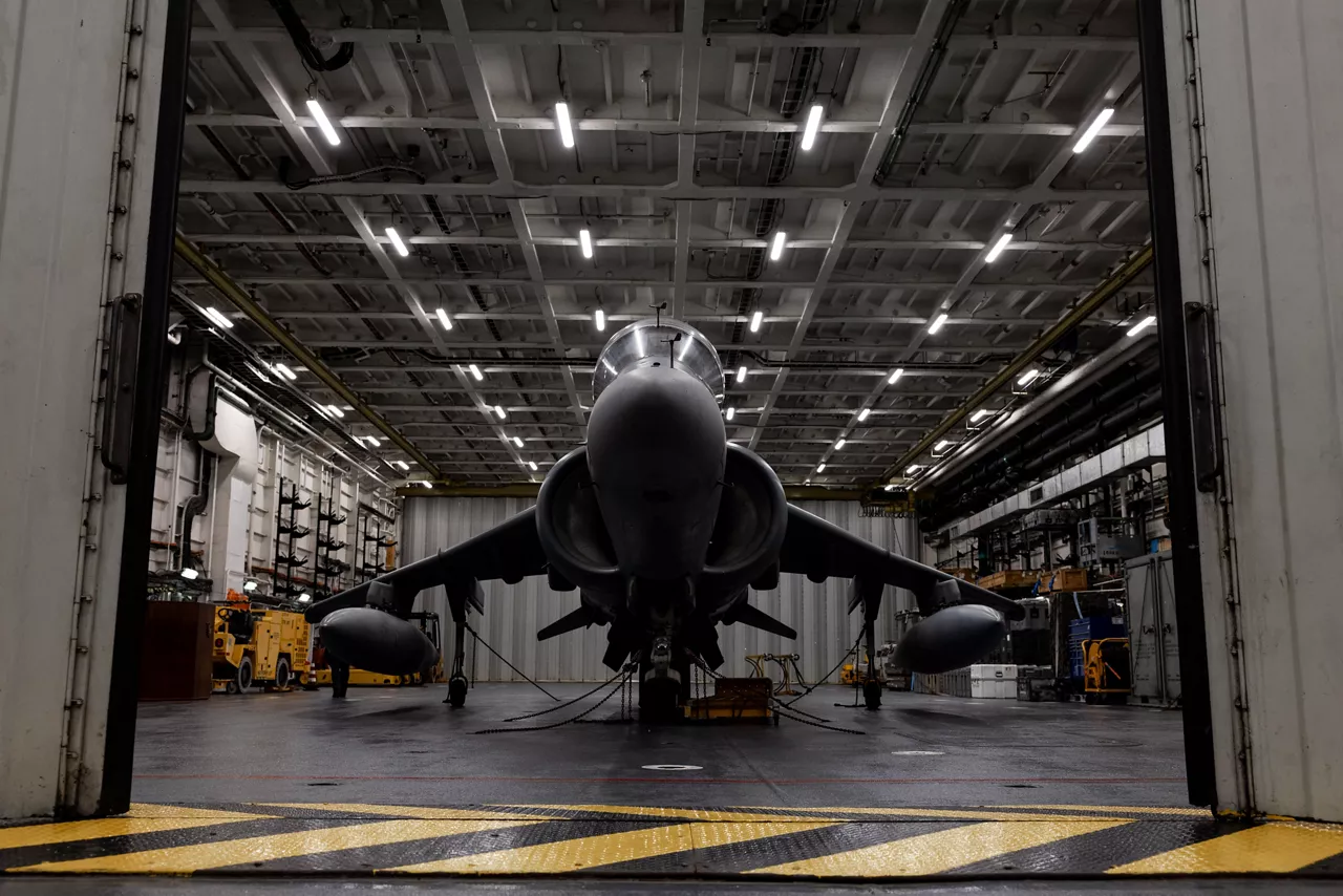 An Italian Navy AV-8B Harrier II vertical takeoff fighter sits in the hangar bay of the aircraft carrier ITS Cavour during Neptune Strike, an enhanced Vigilance Activity taking place in the Western and Central Mediterranean Sea from 25 March to 1 April 2026. Naval Striking and Support Forces NATO (STRIKFORNATO), a Portugal-based maritime command, leads several Neptune Strike iterations every year, focusing on improving Allied integration at sea while expanding our presence and awareness. This iteration involved Carrier Strike Groups from France, Italy and Spain.