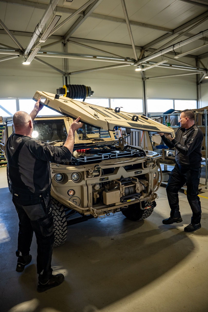Workers fit an engine cover to the GRF lightweight tactical vehicle. As NATO members ramp up defence spending, Europe’s defence industrial base is stepping up to meet demand. Defenture, a defence company founded in 2013 and headquartered in Tiel, the Netherlands, specialises in producing light tactical mobility solutions. Vehicles designed not just for transport, but for survivability and flexibility. 
Engineers, technicians, and assembly teams work side by side, transforming raw components into mission-ready vehicles, including the lightweight and maneuverable GRF and the powerful Mammoth. These vehicles are destined for use with various NATO allies including Germany and Lithuania.