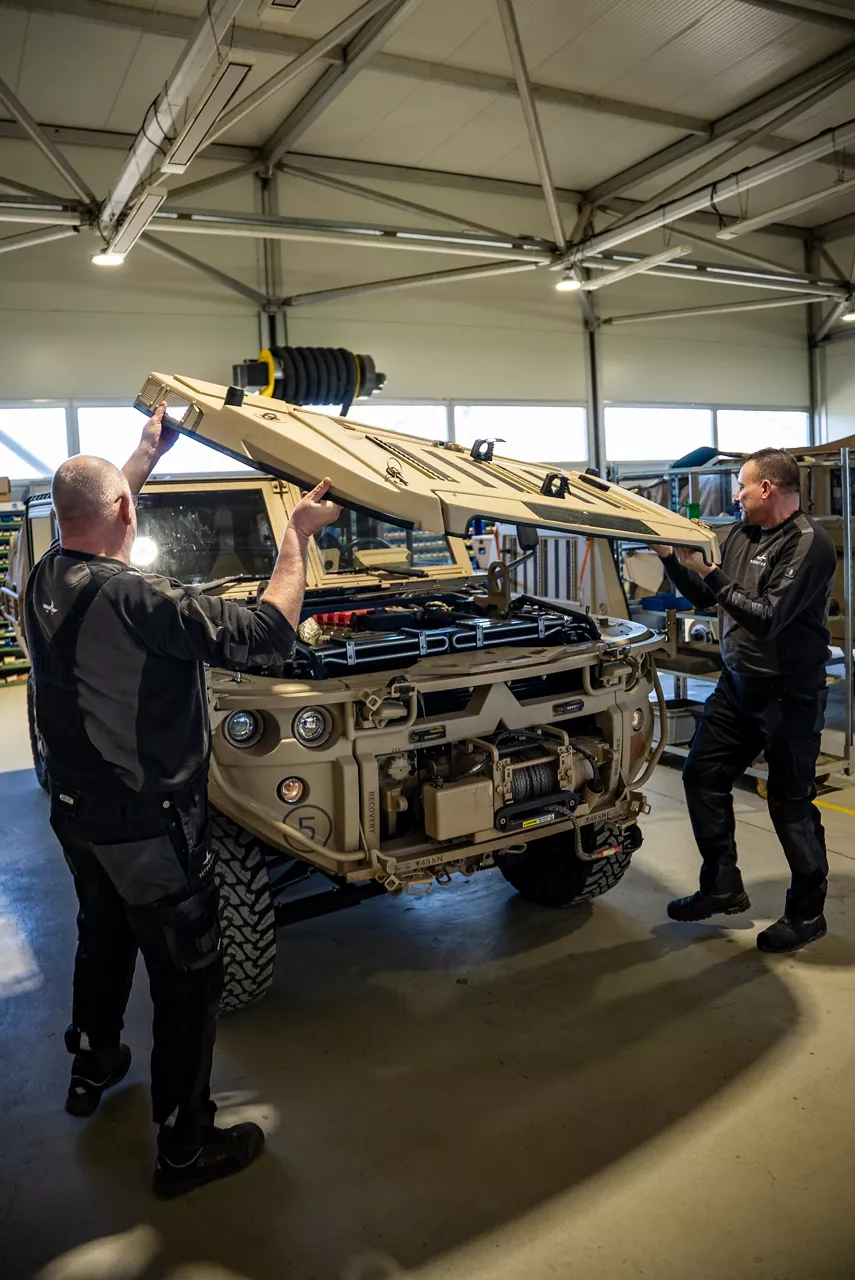 Workers fit an engine cover to the GRF lightweight tactical vehicle. As NATO members ramp up defence spending, Europe’s defence industrial base is stepping up to meet demand. Defenture, a defence company founded in 2013 and headquartered in Tiel, the Netherlands, specialises in producing light tactical mobility solutions. Vehicles designed not just for transport, but for survivability and flexibility. 
Engineers, technicians, and assembly teams work side by side, transforming raw components into mission-ready vehicles, including the lightweight and maneuverable GRF and the powerful Mammoth. These vehicles are destined for use with various NATO allies including Germany and Lithuania.
